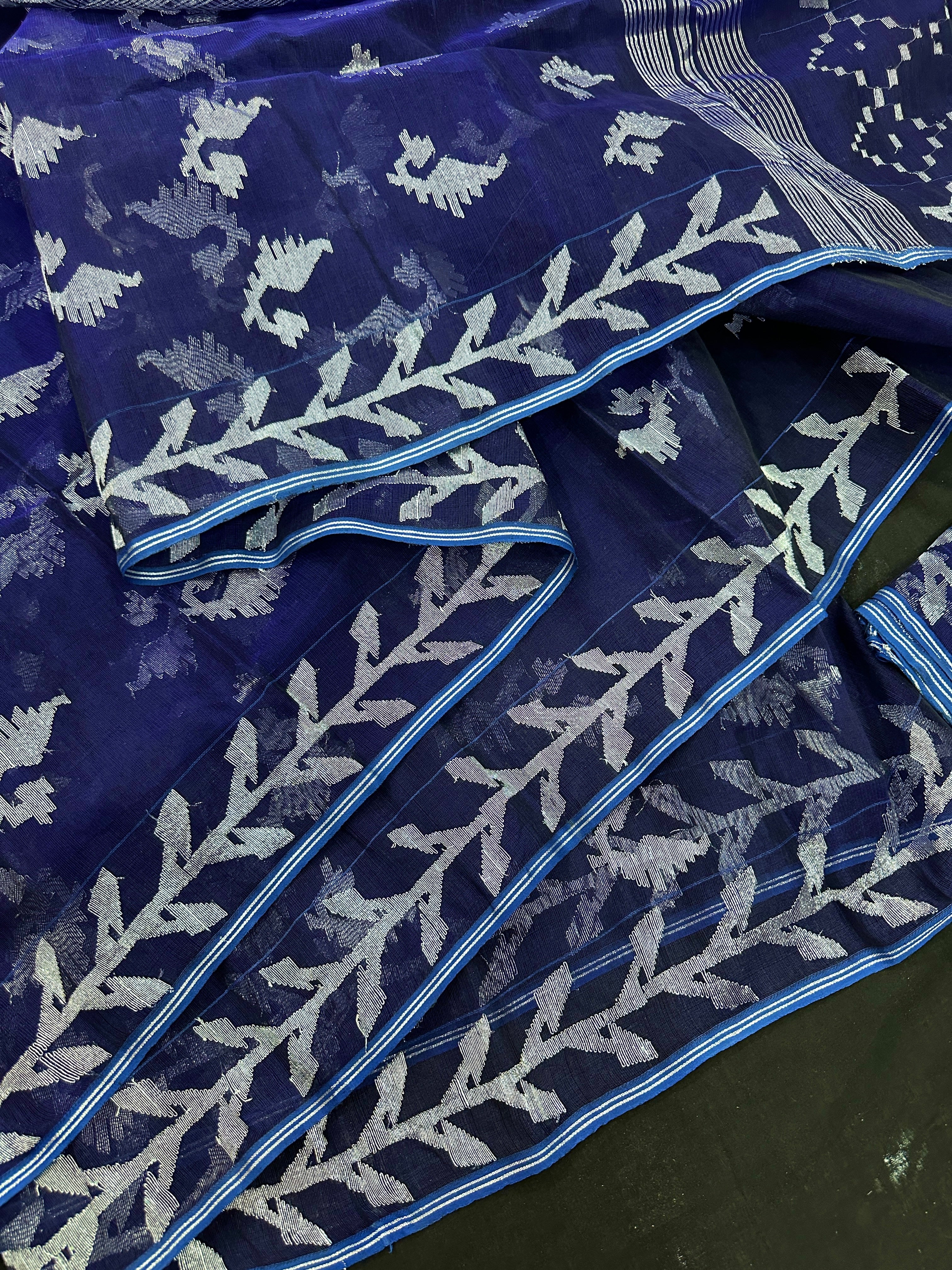 Navy blue jamdani saree with silver jori work soft threads all over work.