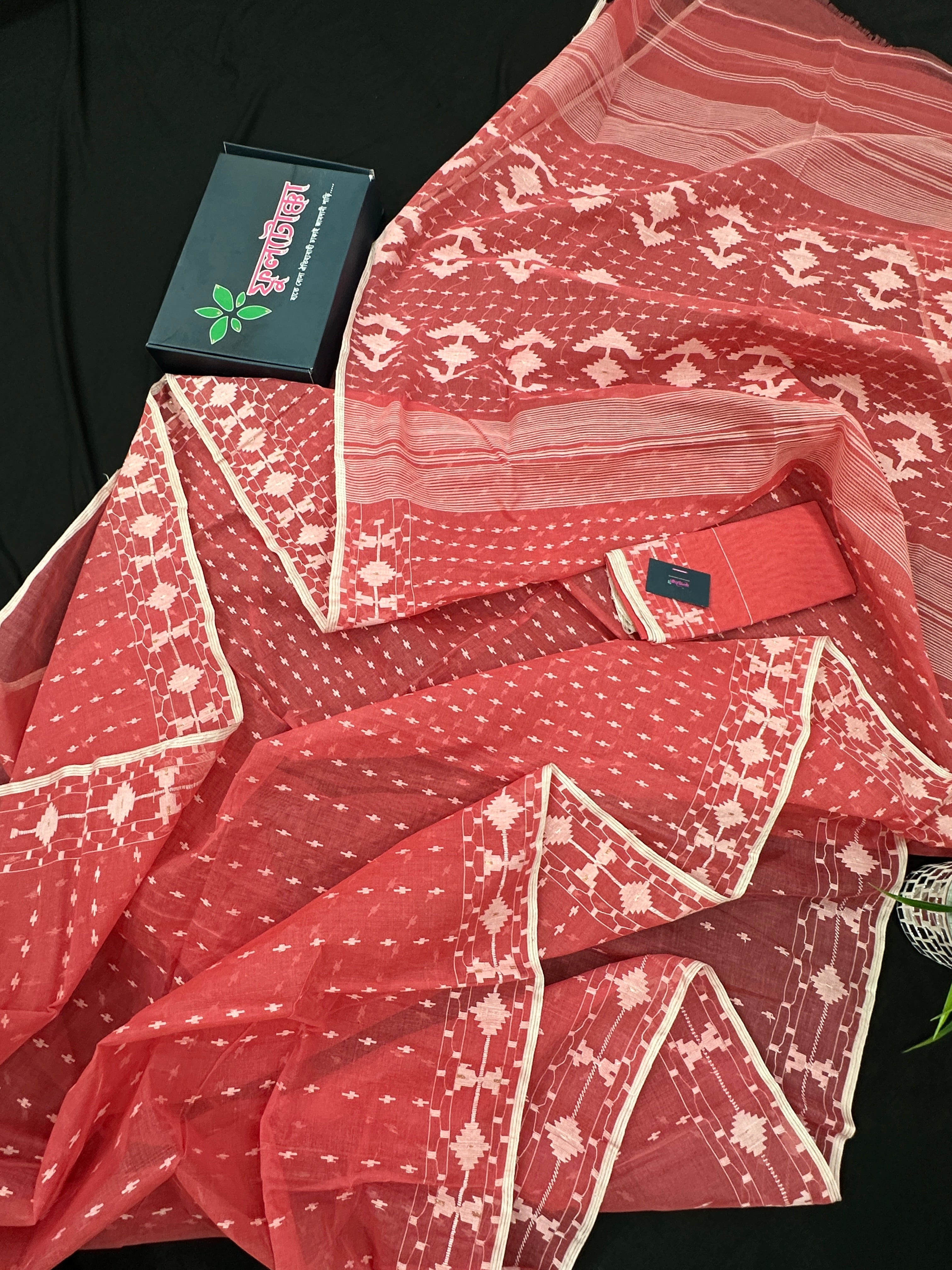 Sweet pink cotton jamdani saree with white threads work and blouse piece.