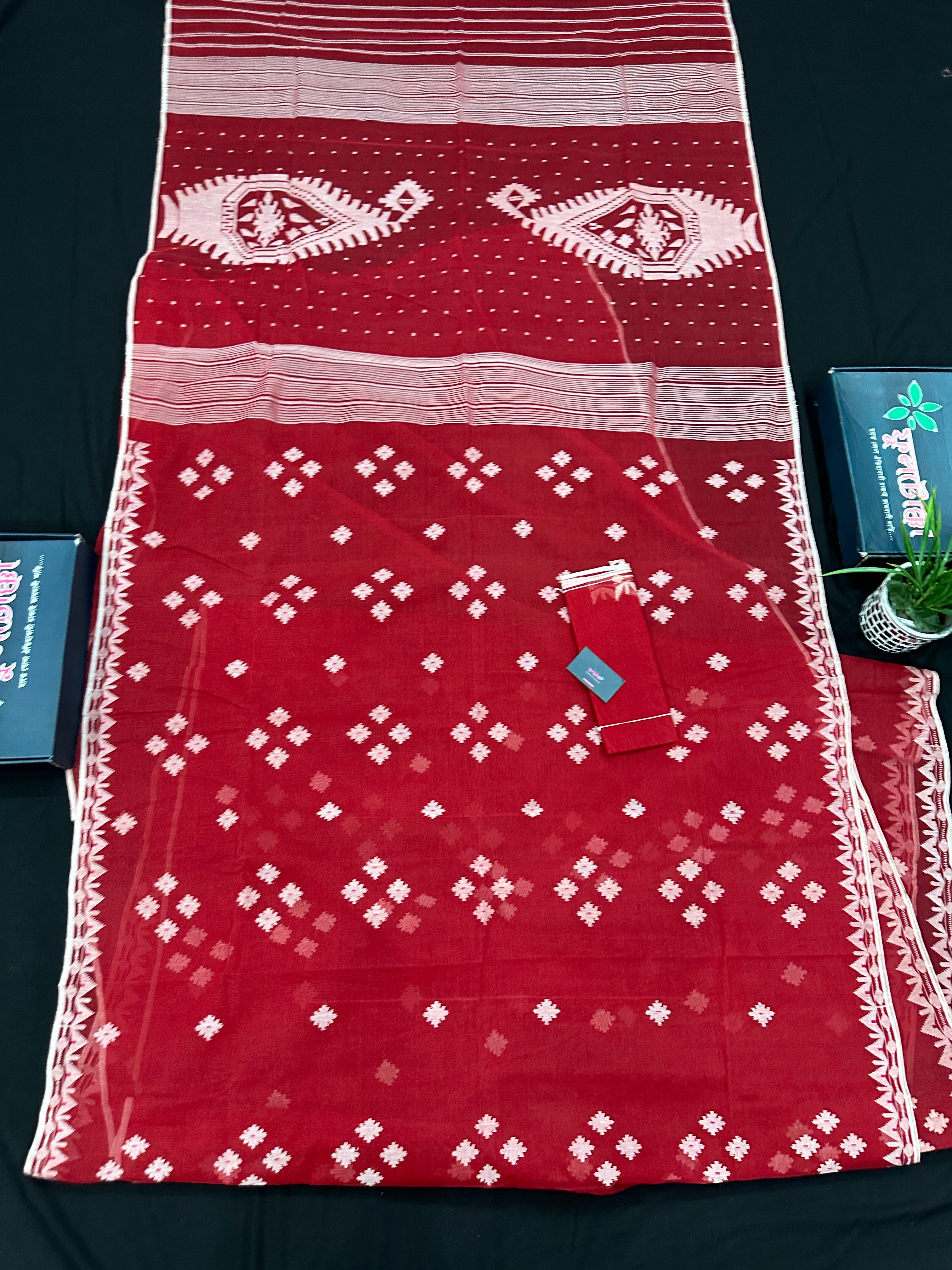 Radish Maroon cotton jamdani saree with white threads work all over work.