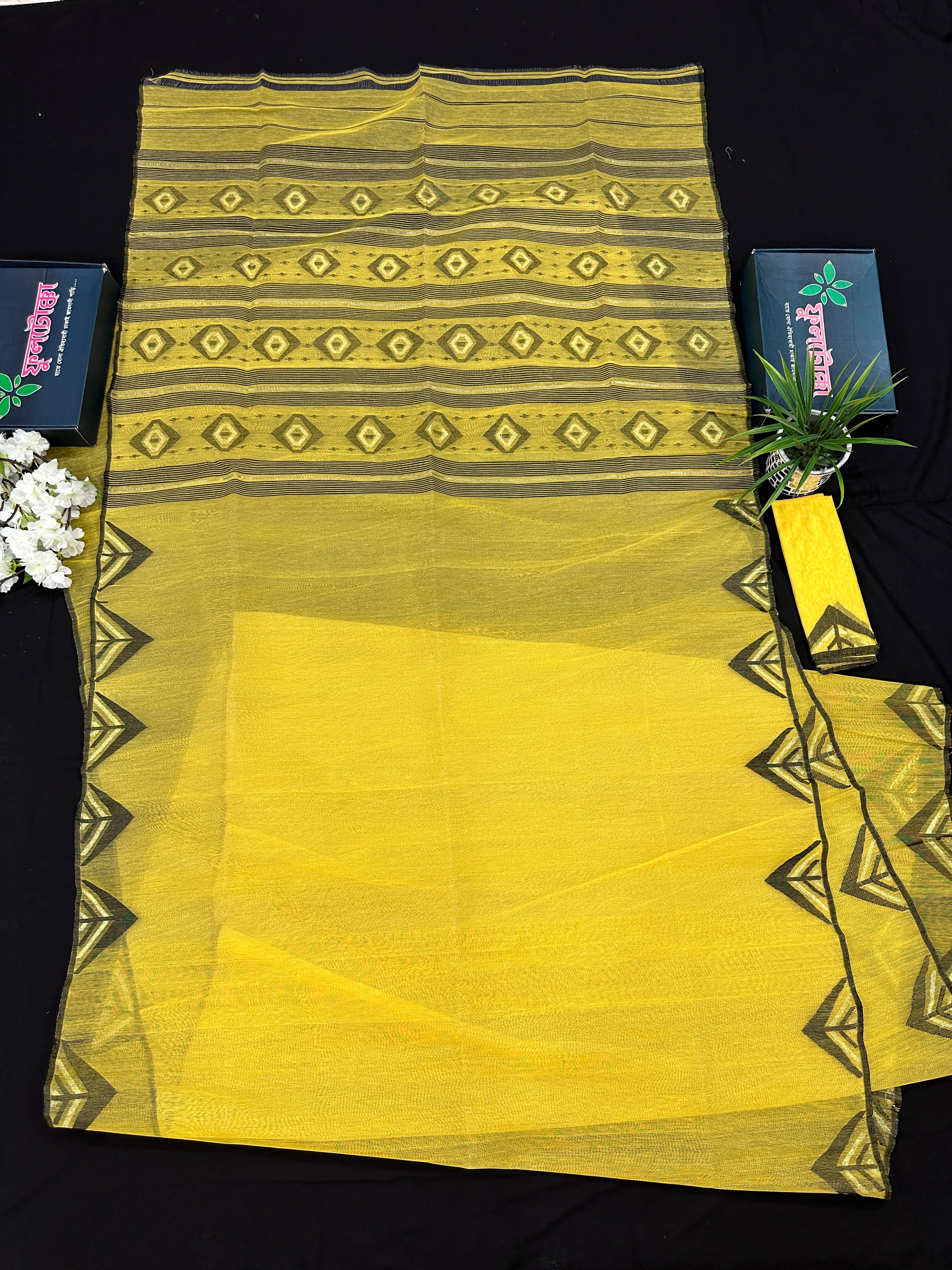 Yellow cotton jamdani sari with simple paar.