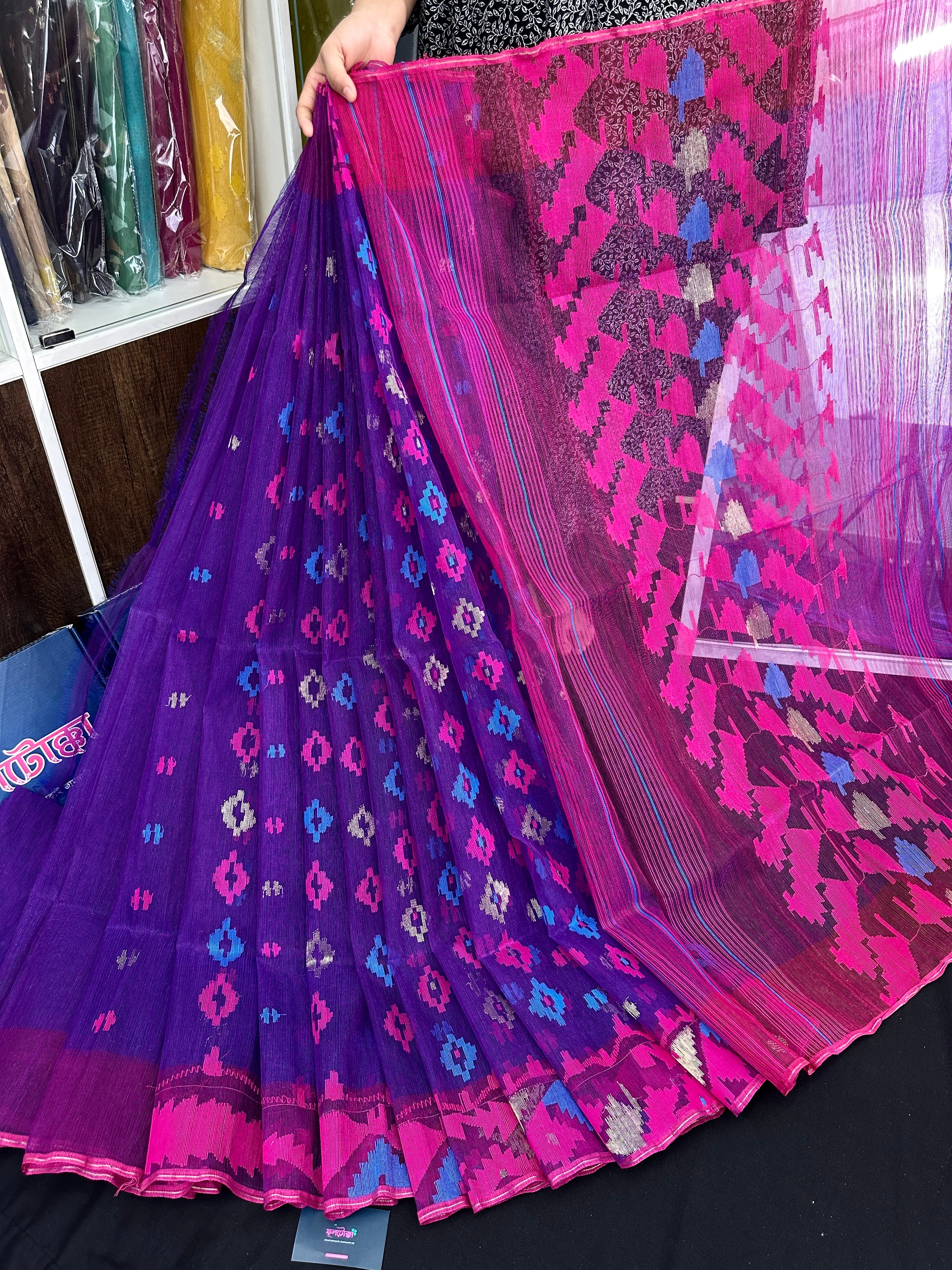 Purple halfsilk jamdani saree with blue pink threads work and golden jori work