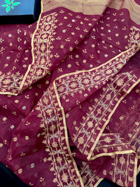 Maroon cotton jamdani with yellowish threads work.