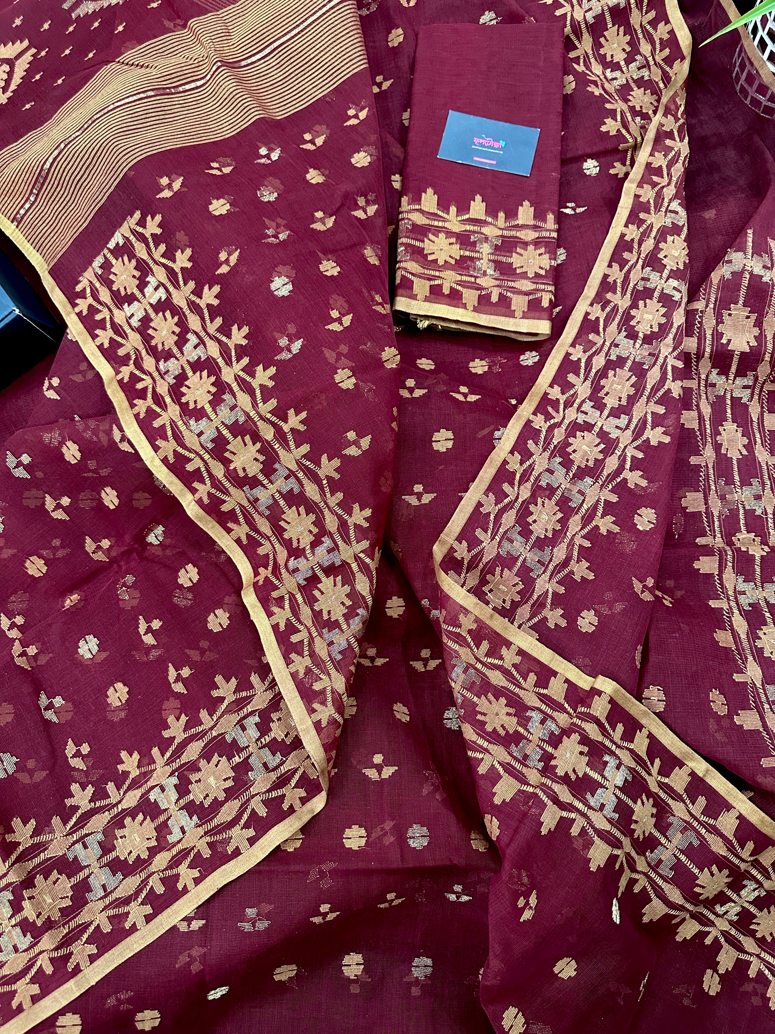 Maroon cotton jamdani with yellowish threads work.