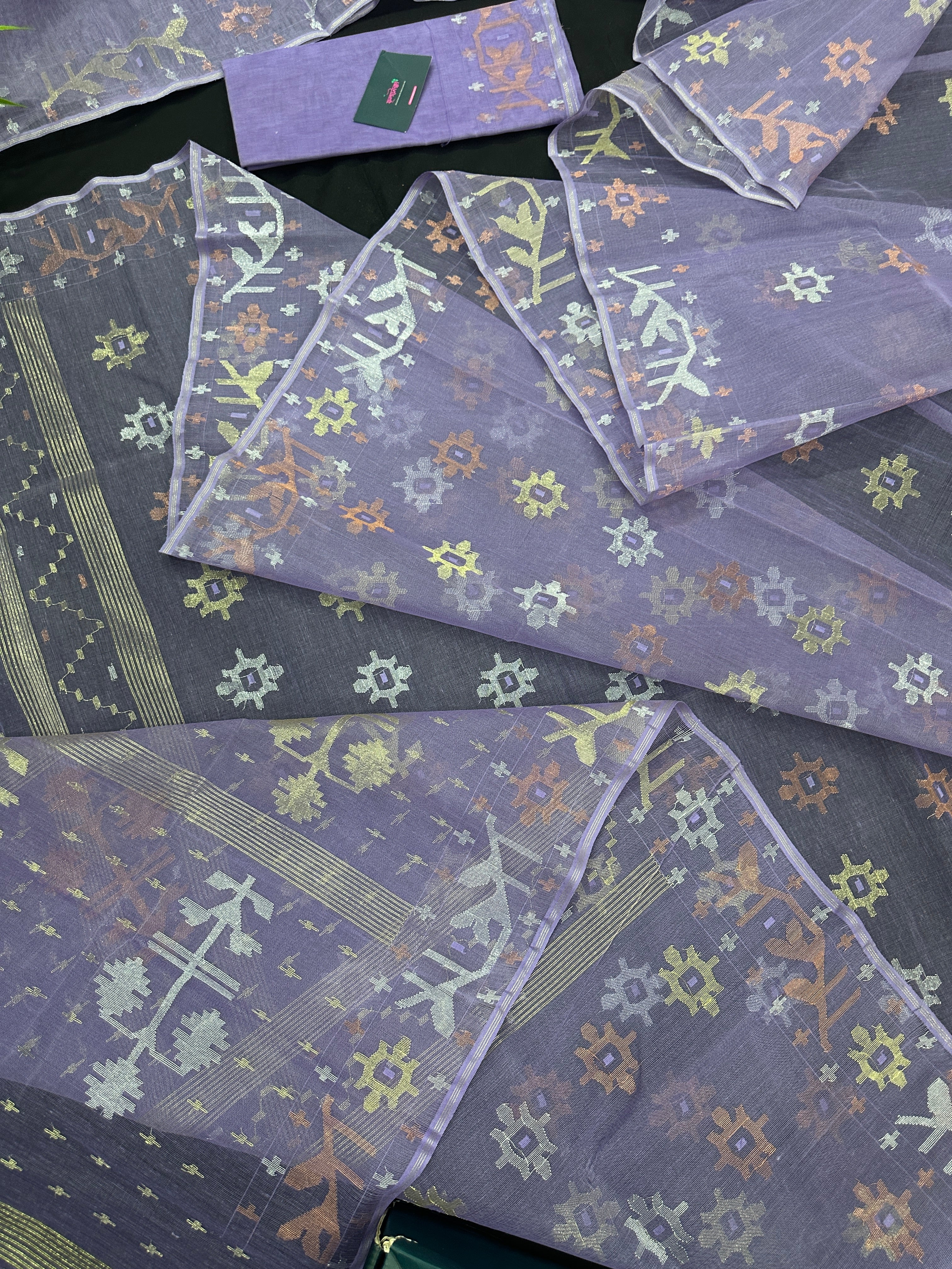 Lite lavender jamdani saree with golden silver copper jori work.