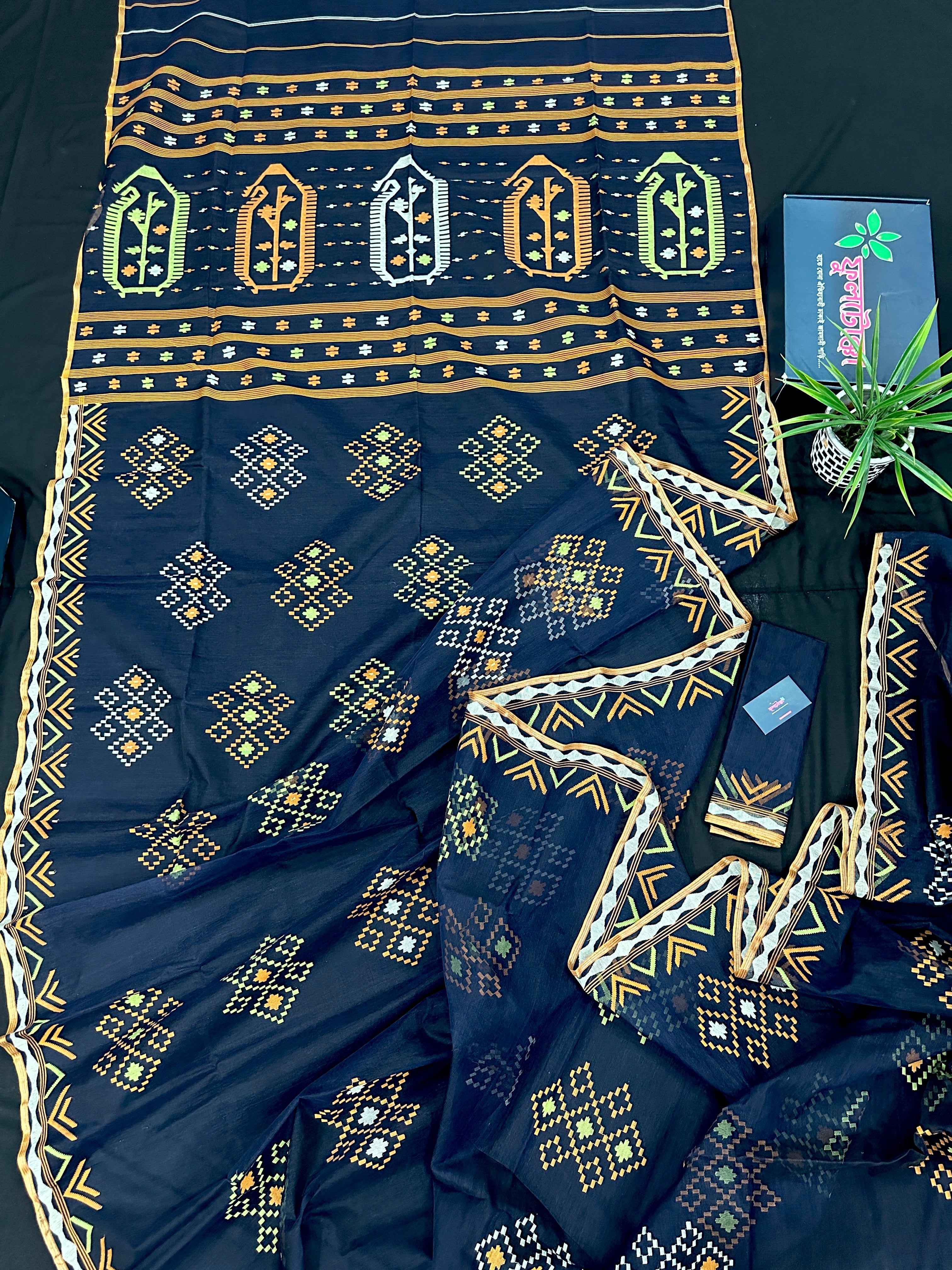 Navy blue jamdani saree with orange  green & off white threads work.