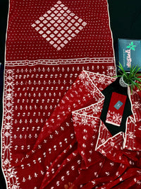 Maroon jamdani saree with white thread work.