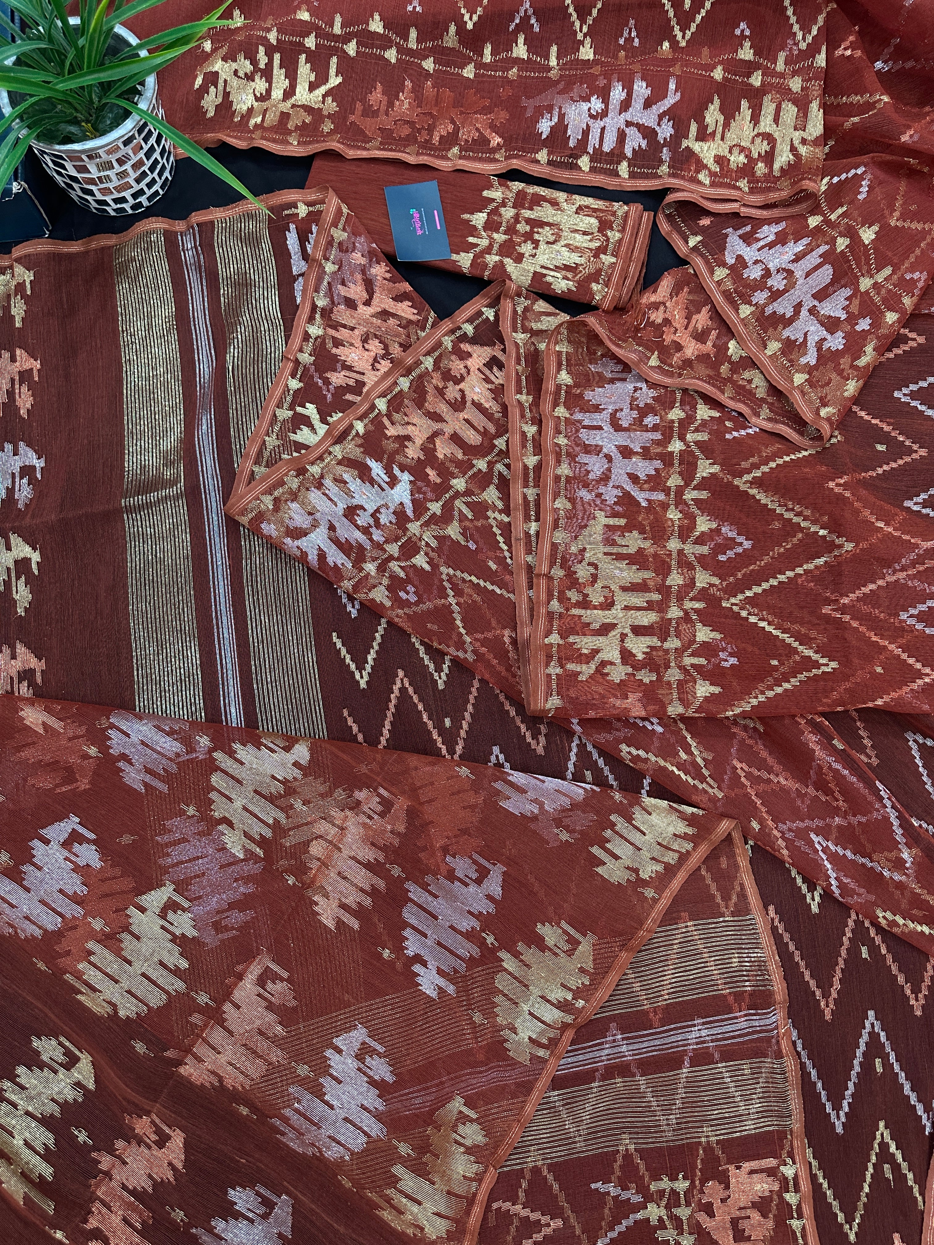 Brown reshom halfsilk jamdani saree with golden silver & copper jori work.