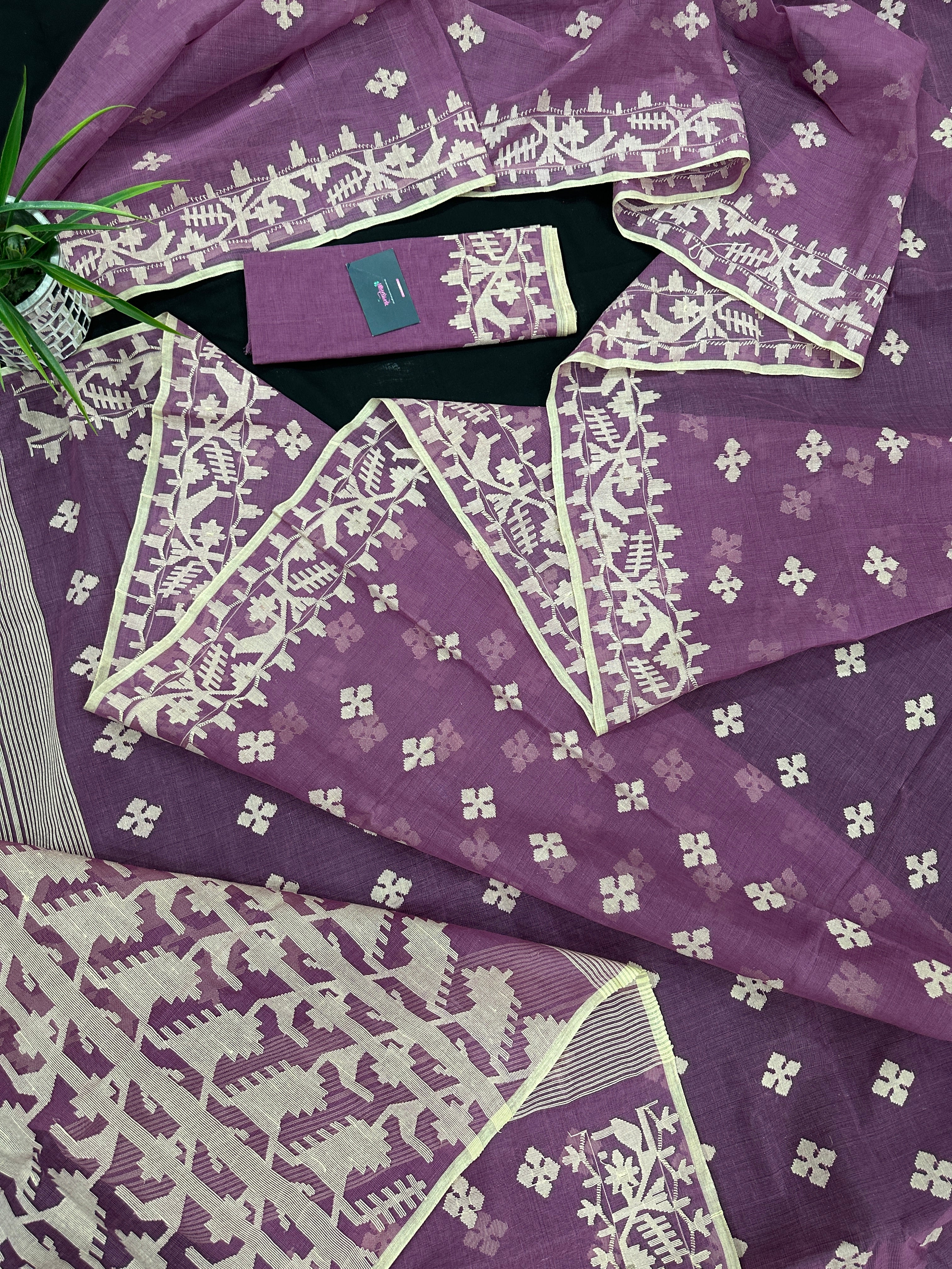 Onion cotton jamdani saree with yellowish threads work all over work.