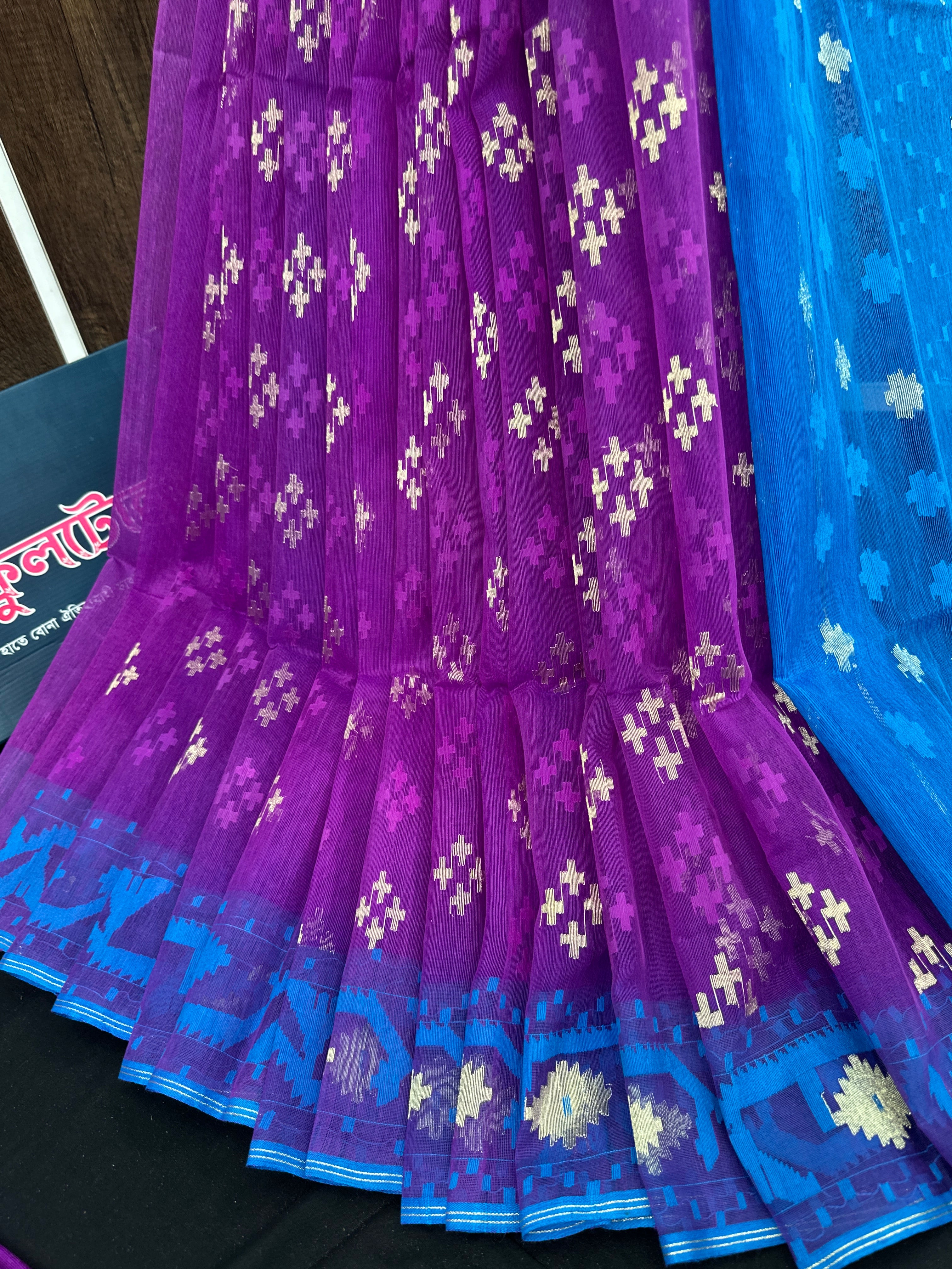 Purple halfsilk jamdani saree with golden jori work and contrast blue paar