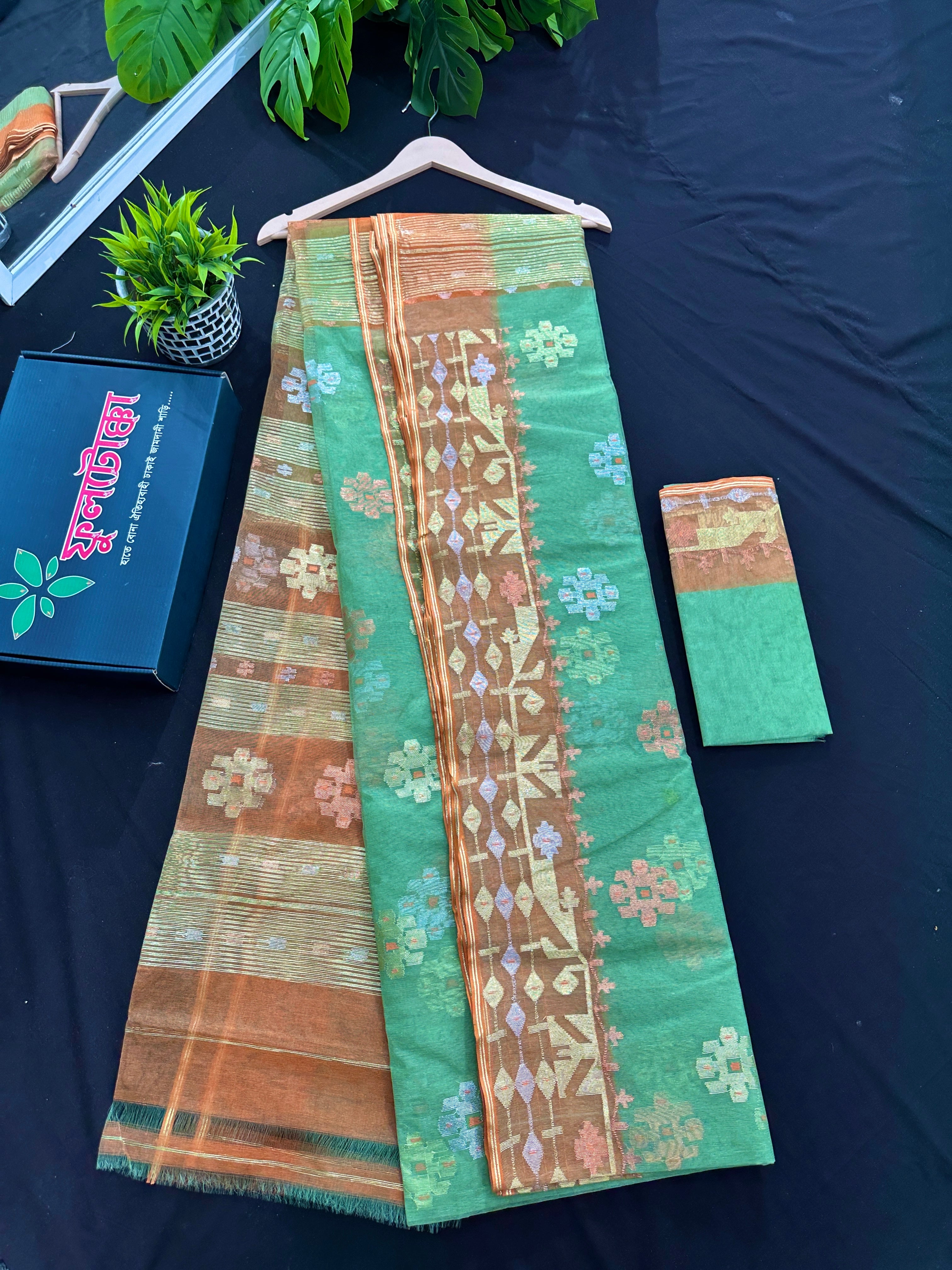 Pastel green halfsilk jamdani saree with golden brown contrast and golden silver copper jori work
