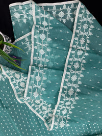 Mint cotton jamdani saree with white threads work all over work and blouse piece.