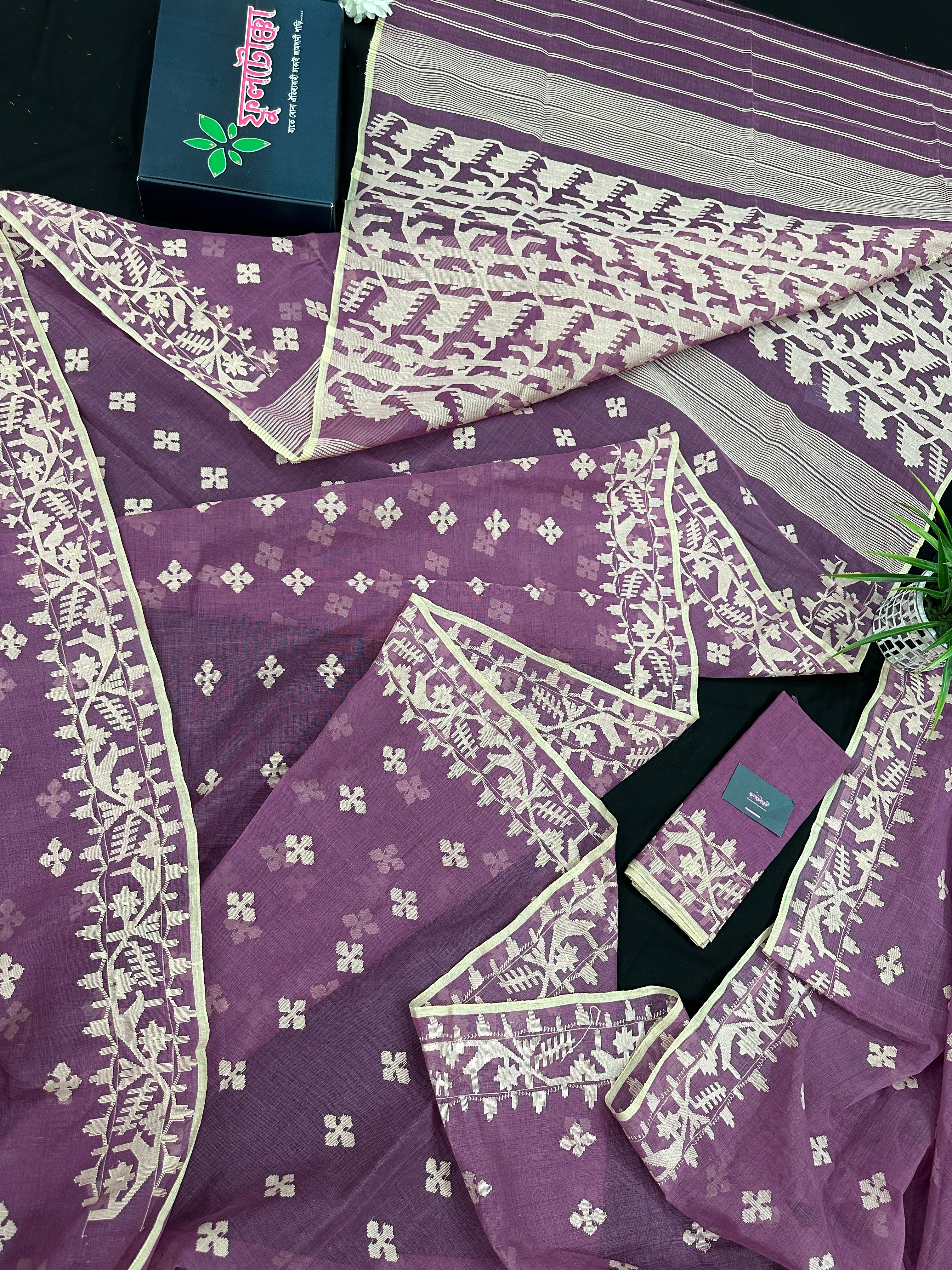Onion cotton jamdani saree with yellowish threads work all over work.