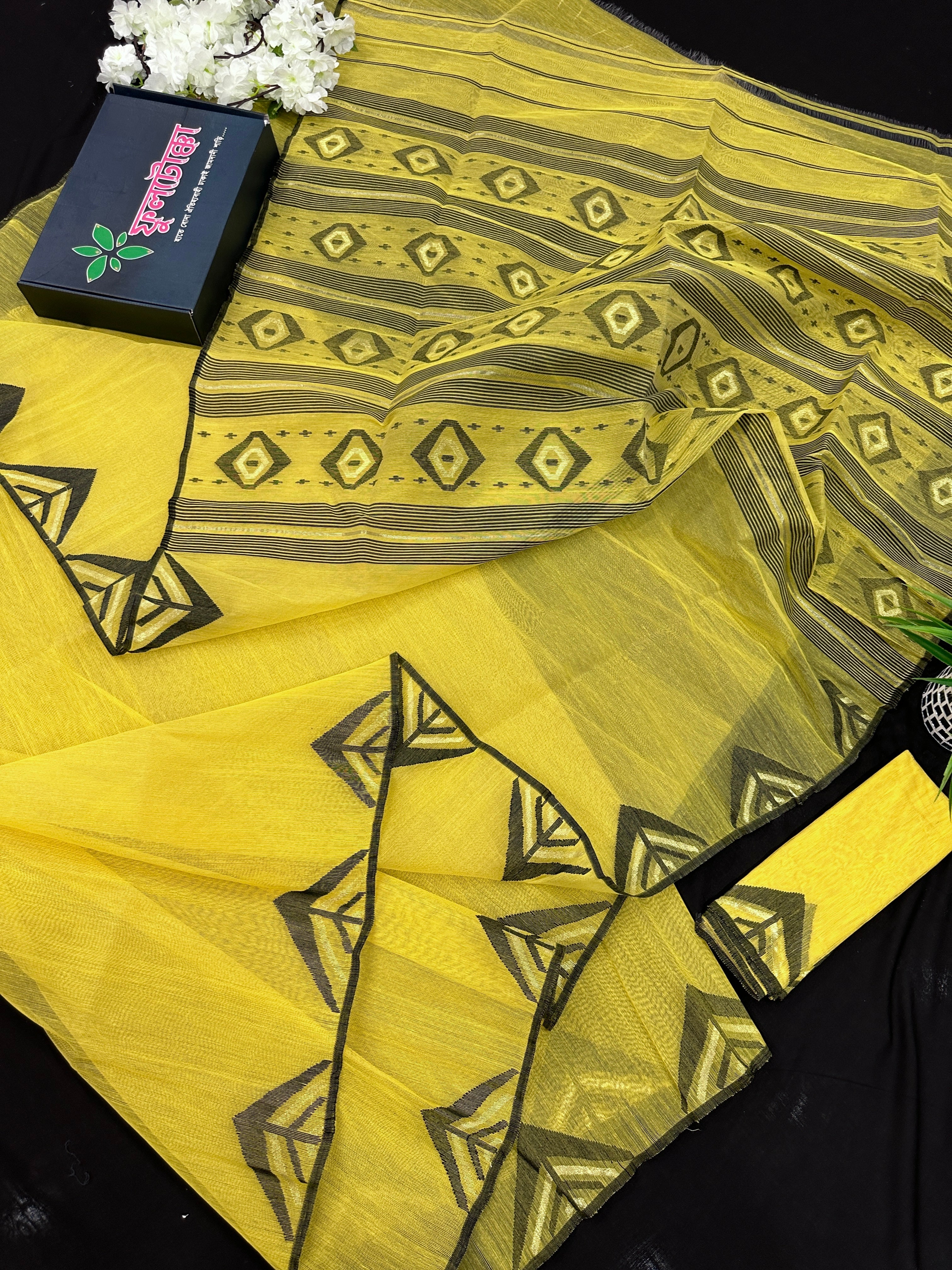 Yellow cotton jamdani sari with simple paar.