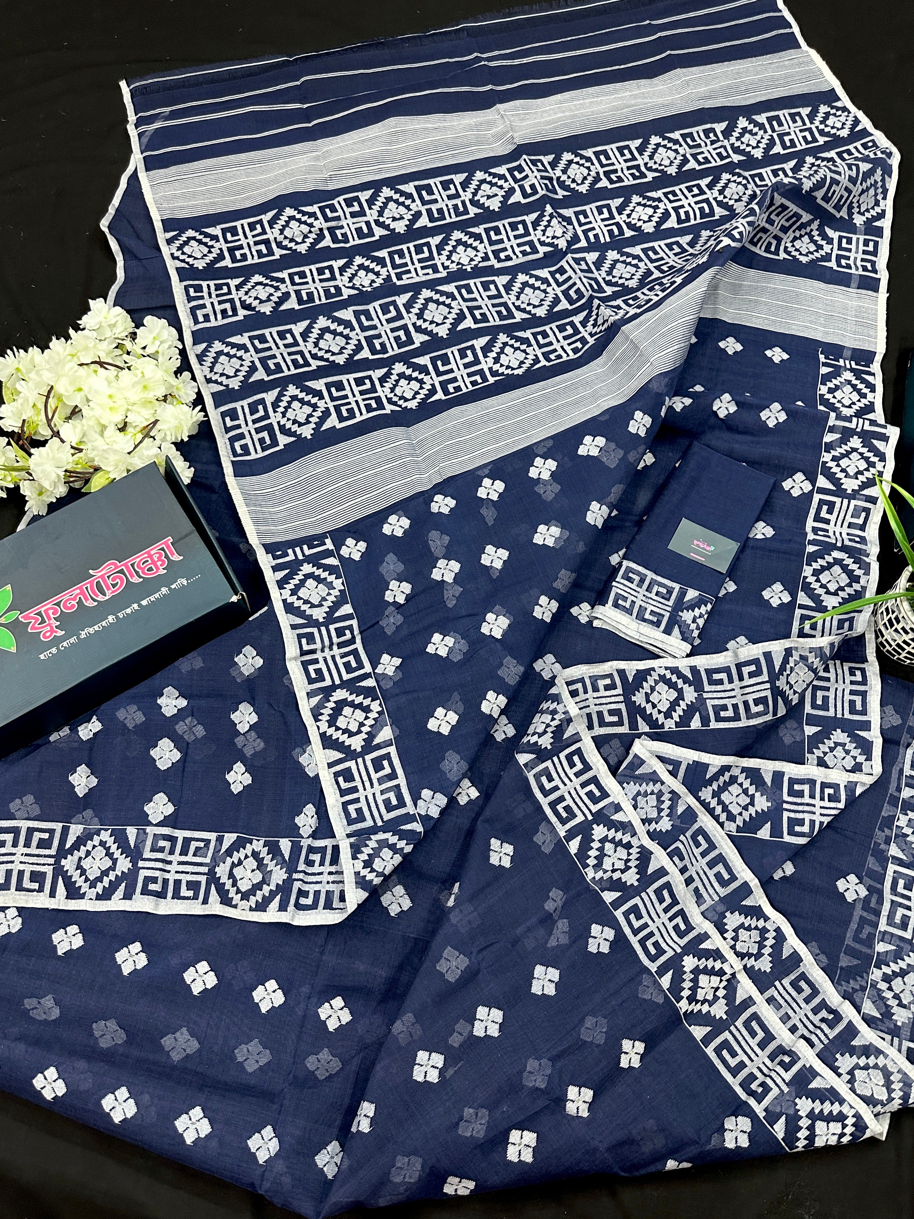 Deep blue jandani saree with white threads all over work.
