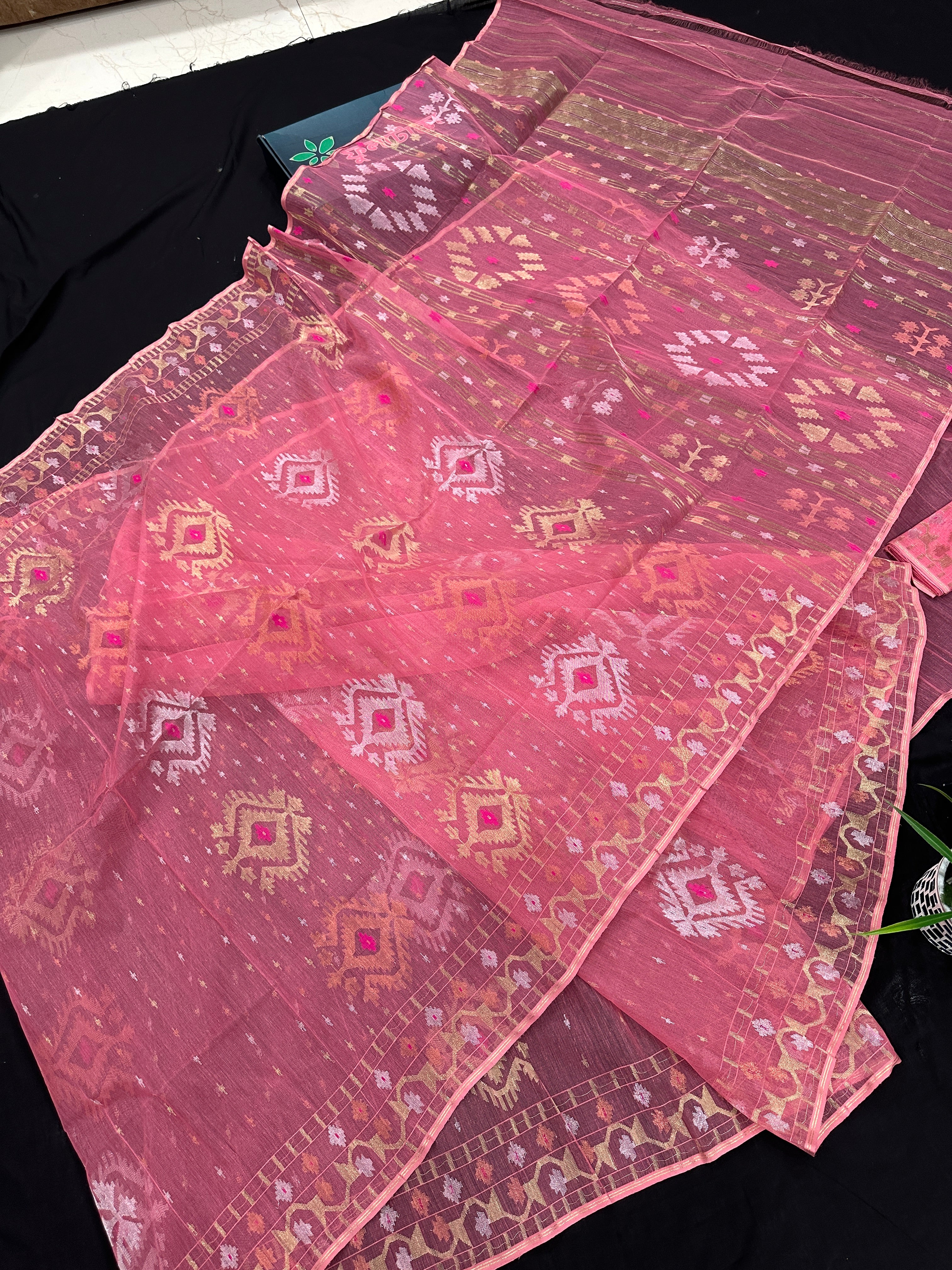 Peach pink jamdani saree with golden silver & copper jori work.