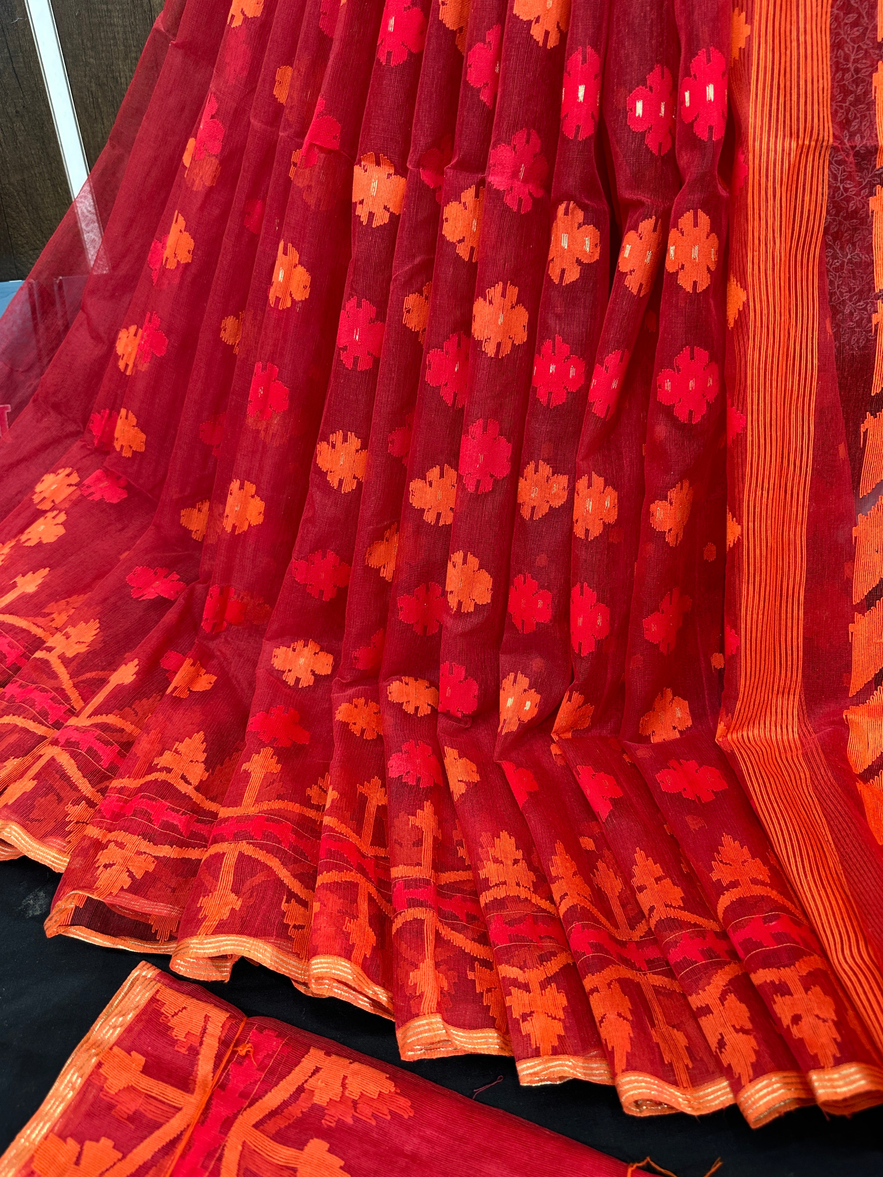 Maroon red jamdani saree with orange and red threads work