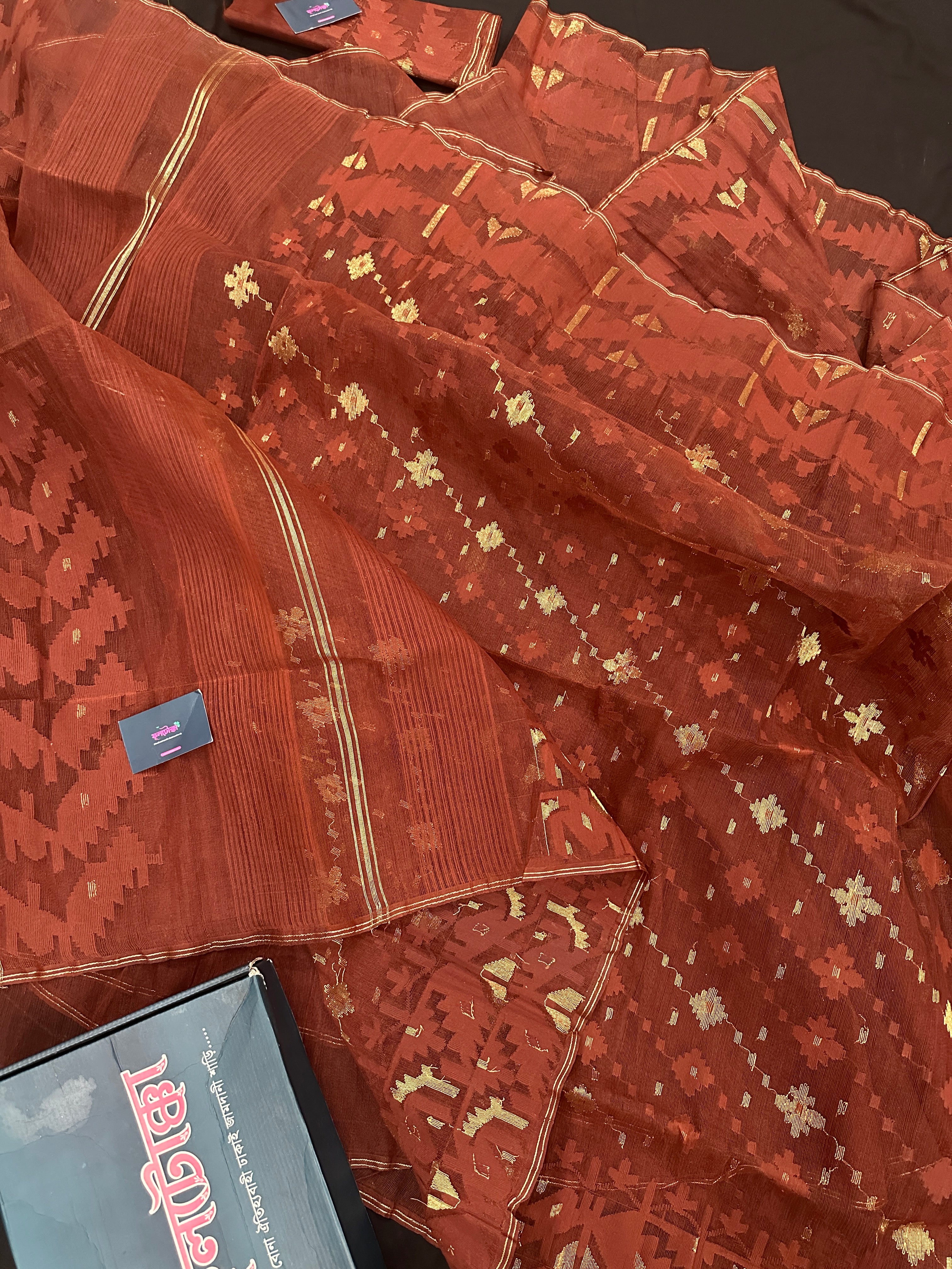 Mehendi brown jamdani saree with golden work.