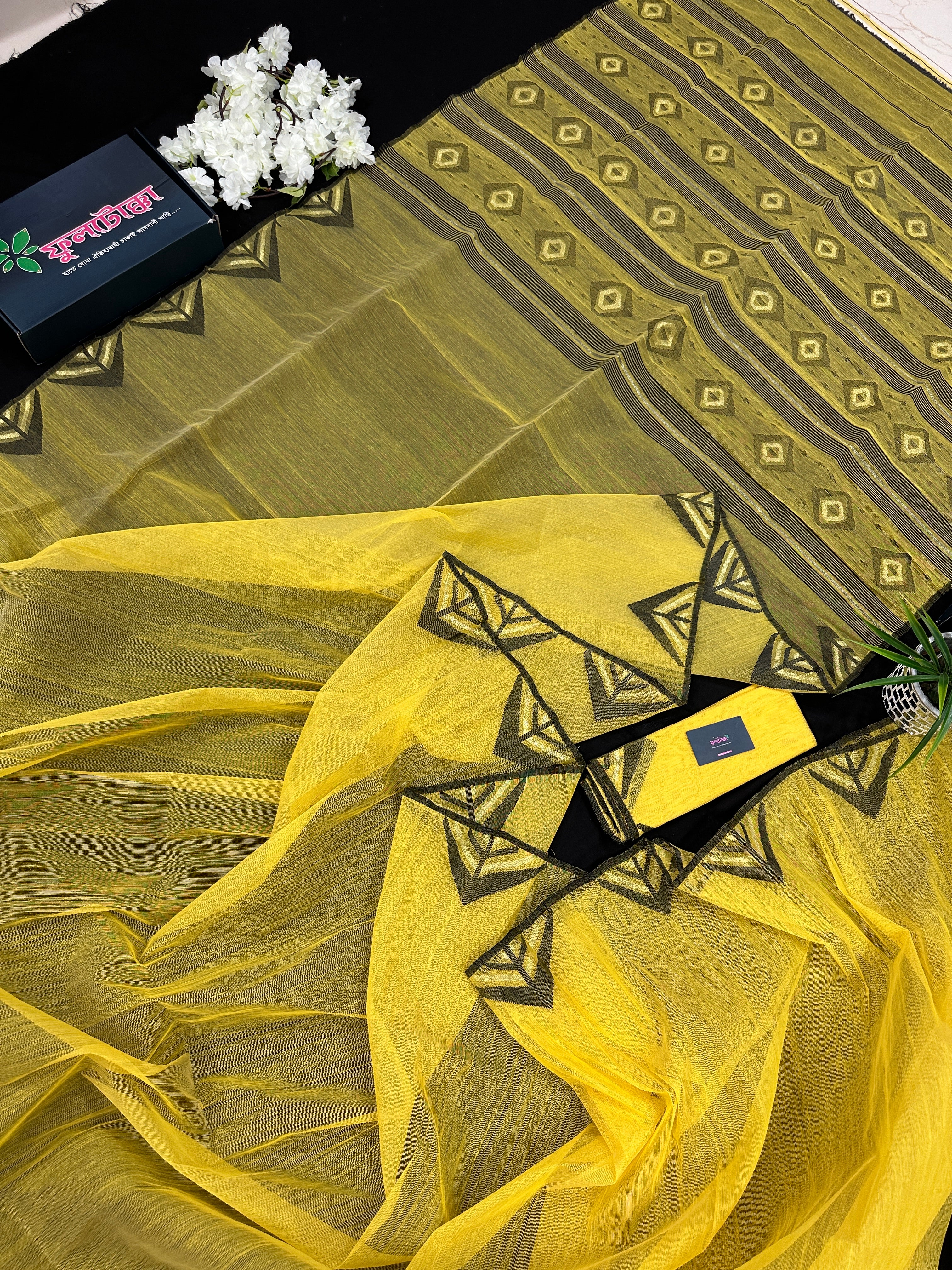Yellow cotton jamdani sari with simple paar.