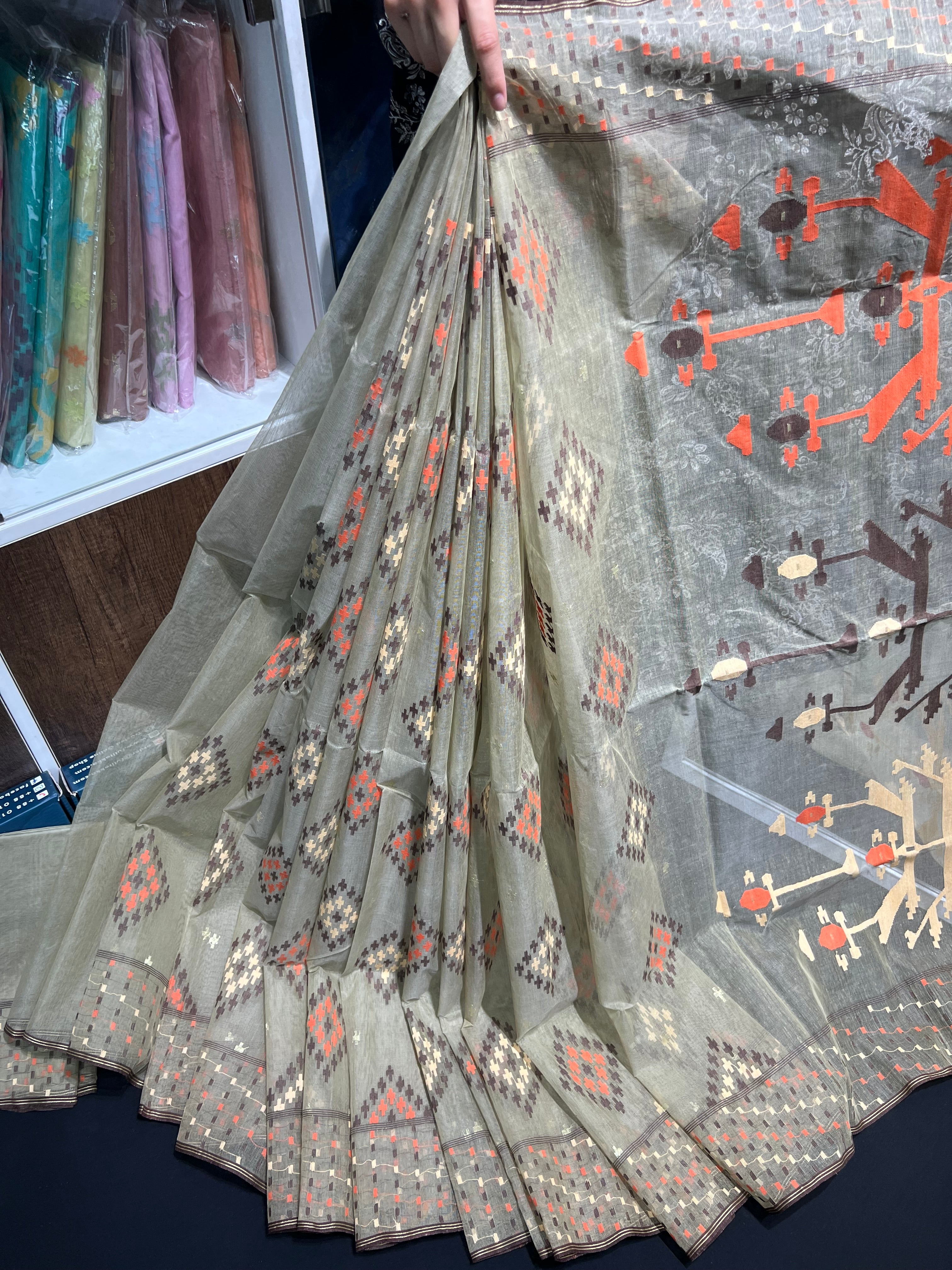 Dark olive halfsilk jamdani saree with orange off white coffe threads work
