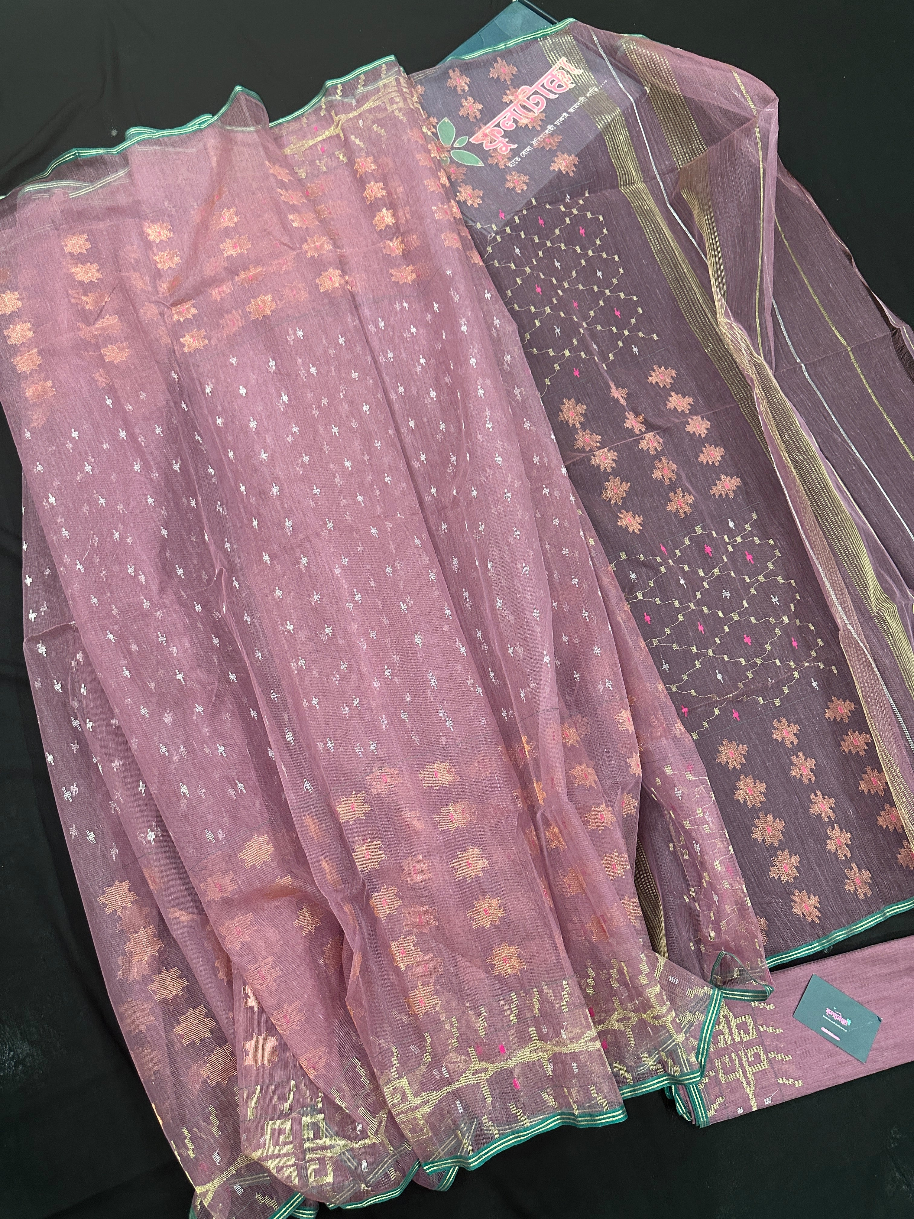 Onion colour jamdani saree with pink meena and green border.