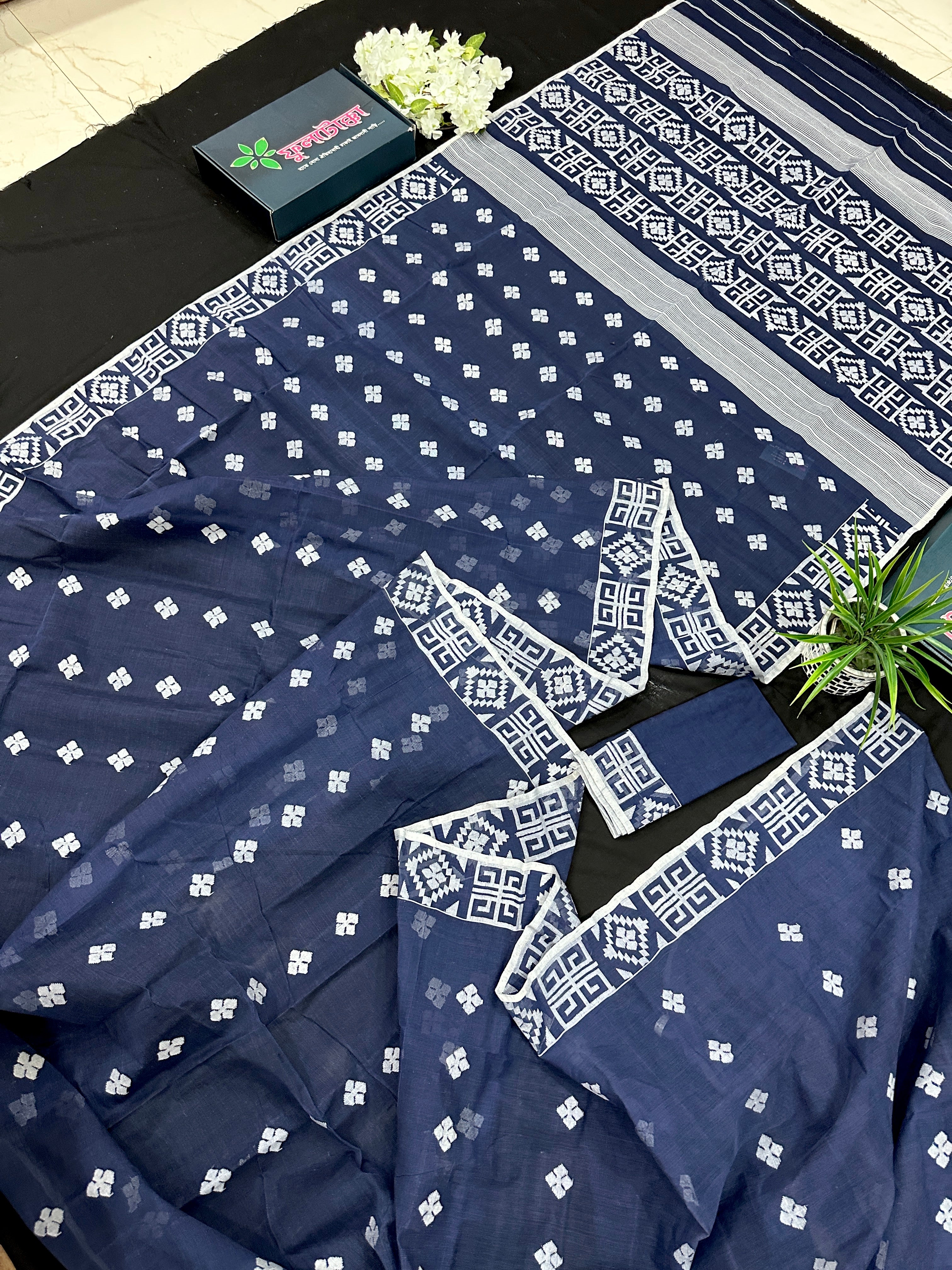 Deep blue jandani saree with white threads all over work.
