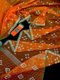 Orange soft jamdani saree with silver jori work & green border.