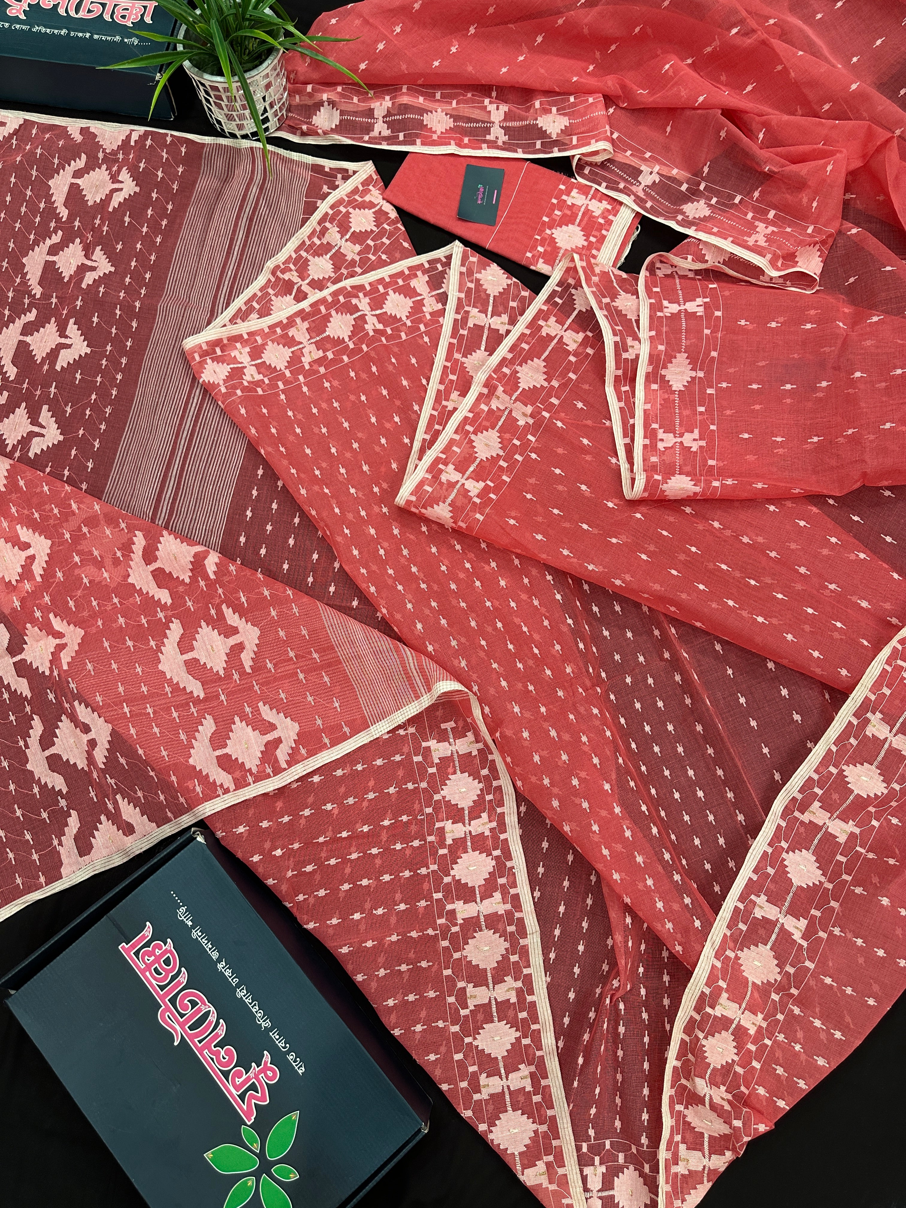 Sweet pink cotton jamdani saree with white threads work and blouse piece.
