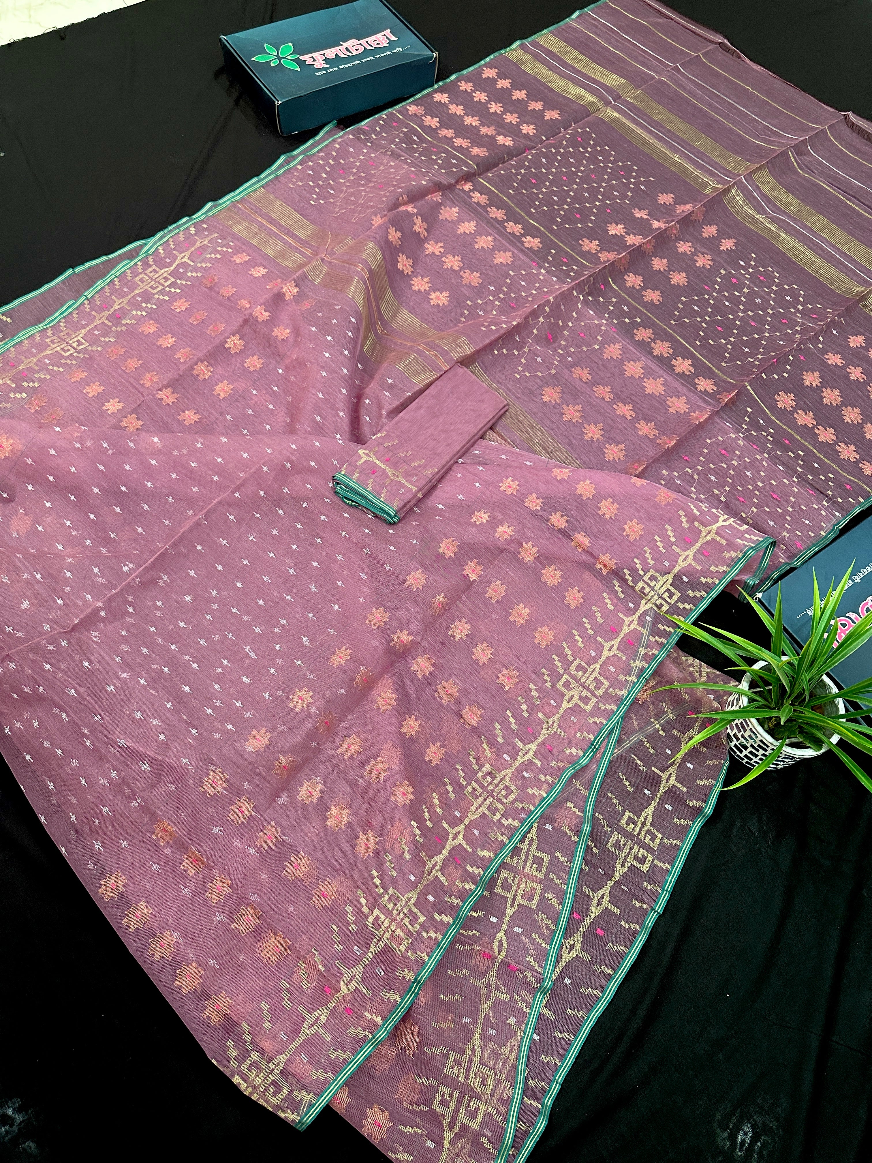 Onion colour jamdani saree with pink meena and green border.