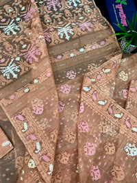 Creamy peach jamdani saree with pink white and peach threads work.