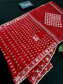 Maroon jamdani saree with white thread work.