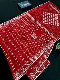 Maroon jamdani saree with white thread work.