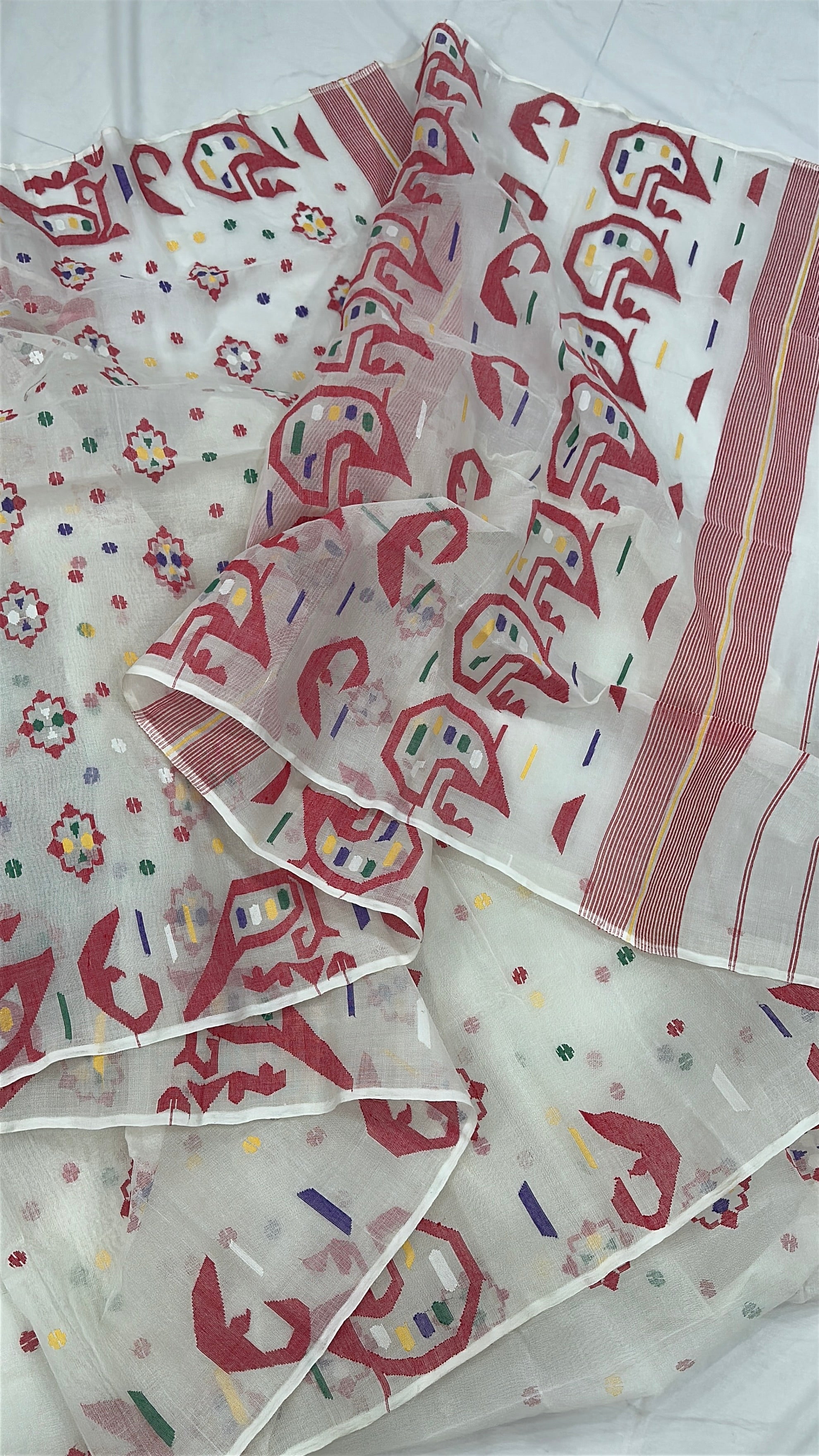 White cotton jamdani saree with multiple colour threads work and blouse piece.