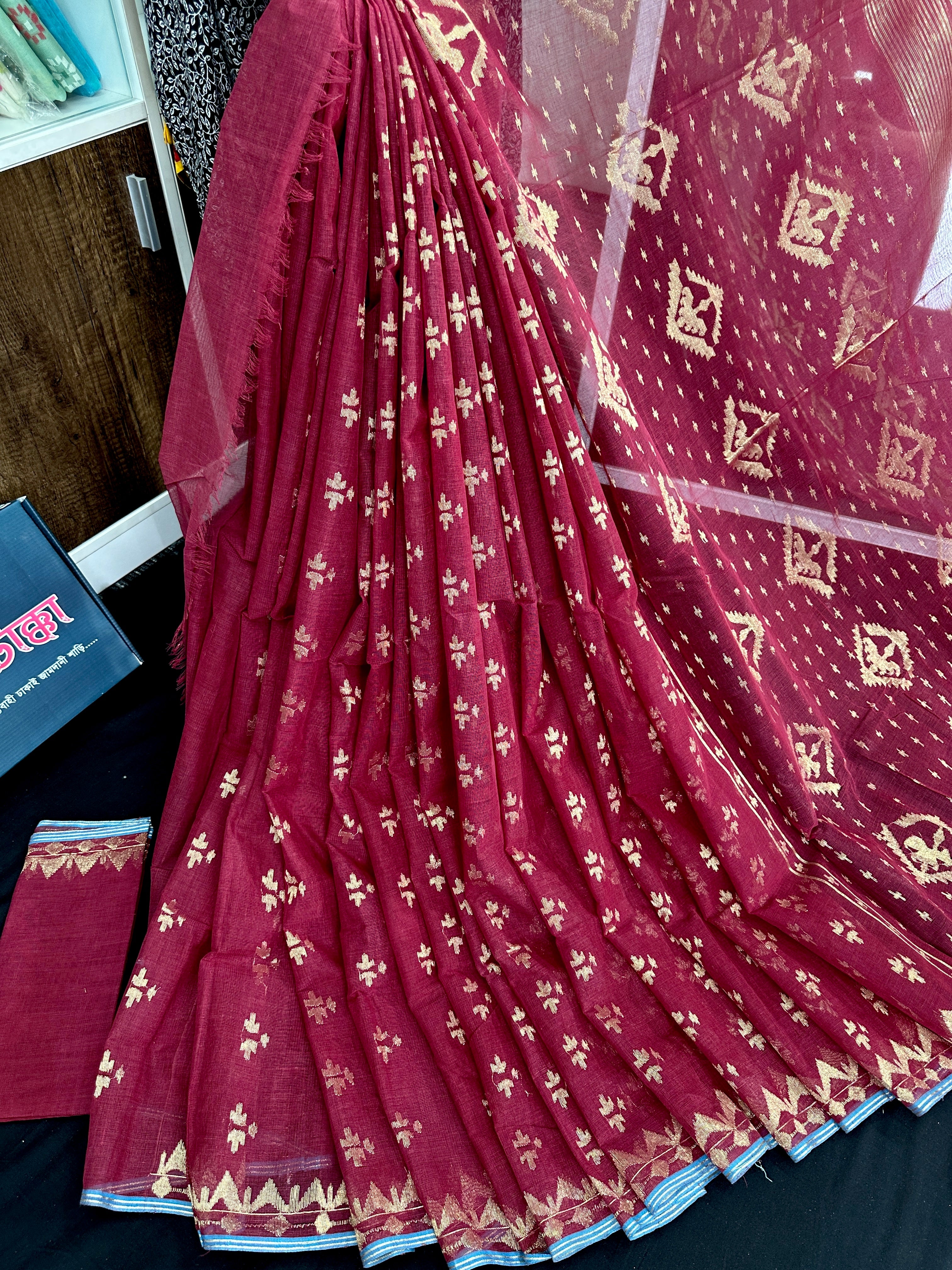 Maroon cotton jamdani saree with golden jori work and blouse piece.