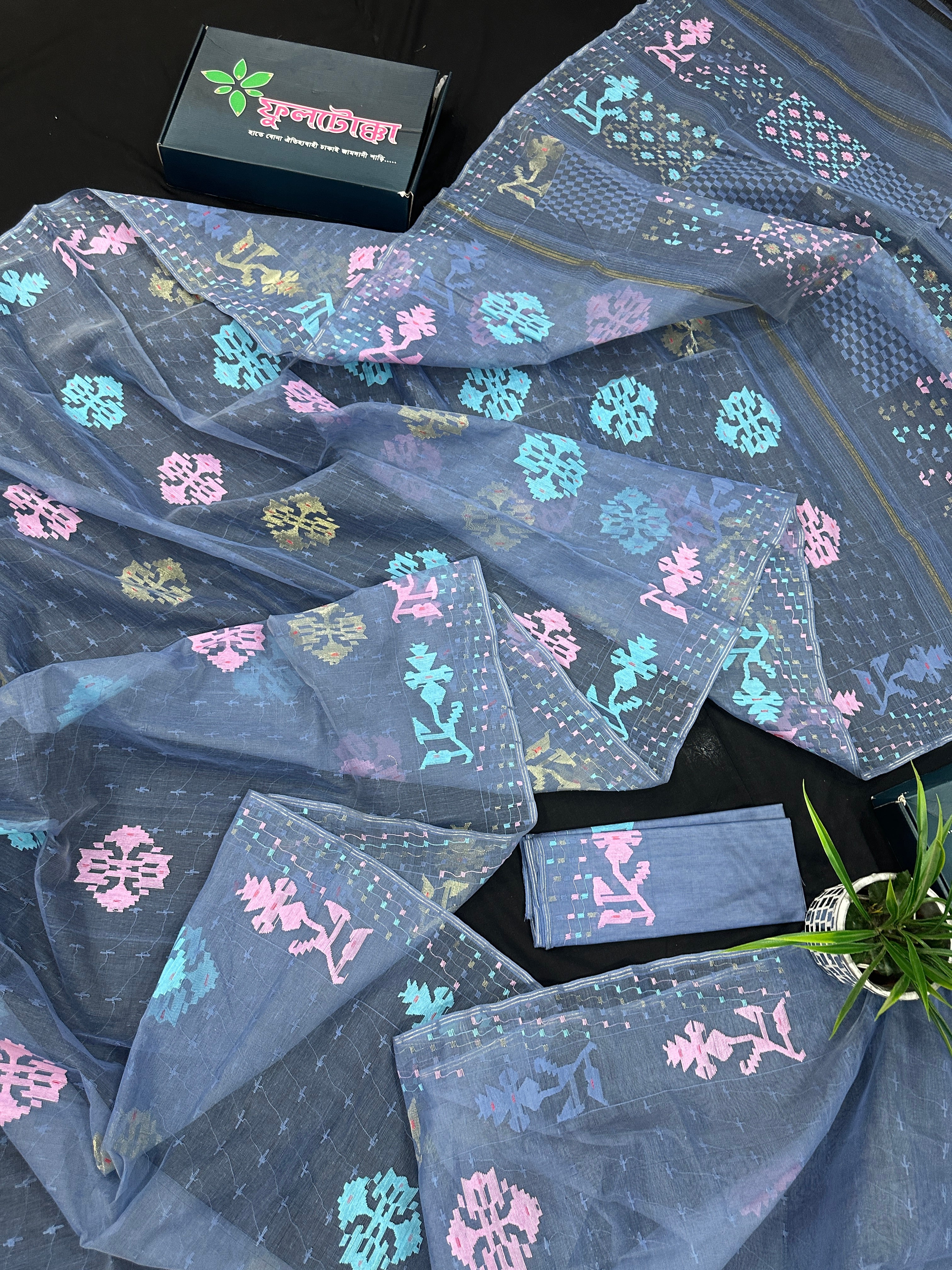 Powdery blue jamdani saree with pink blue and golden jori work.