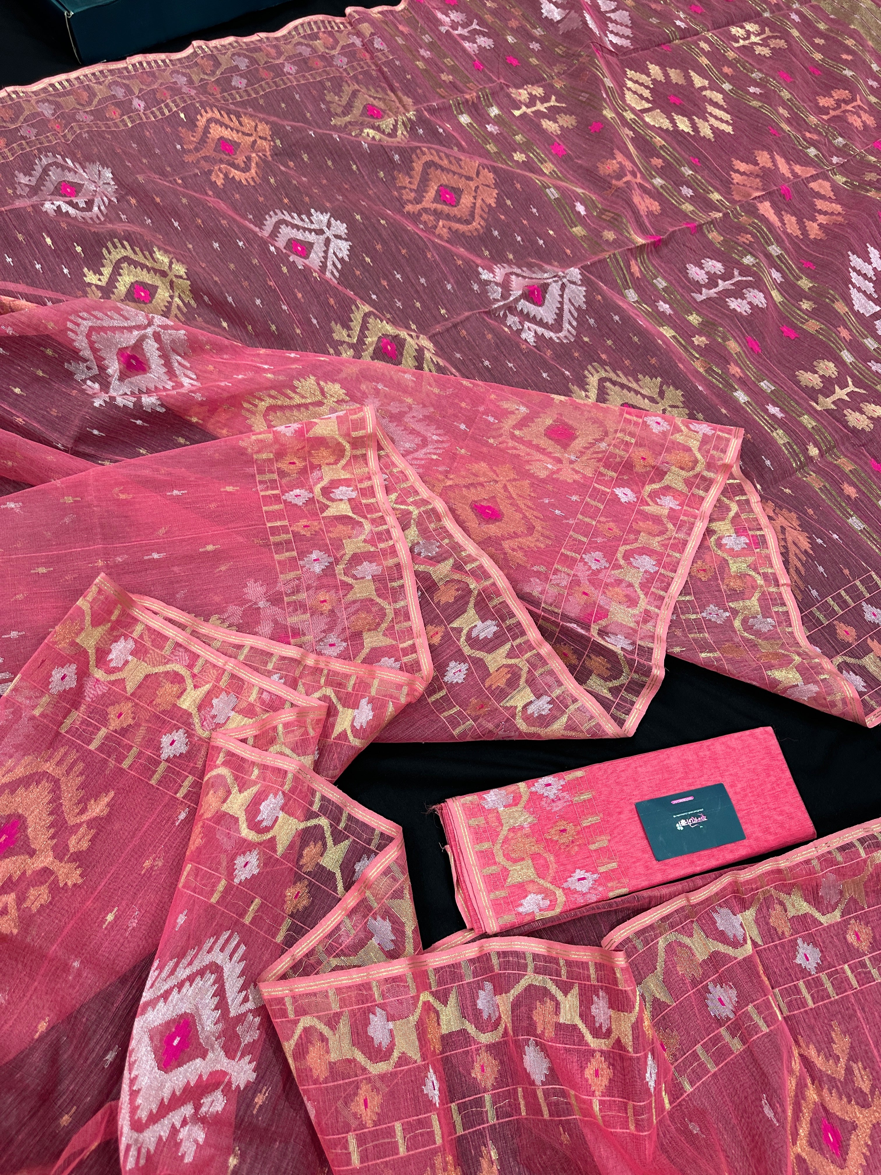 Peach pink jamdani saree with golden silver & copper jori work.