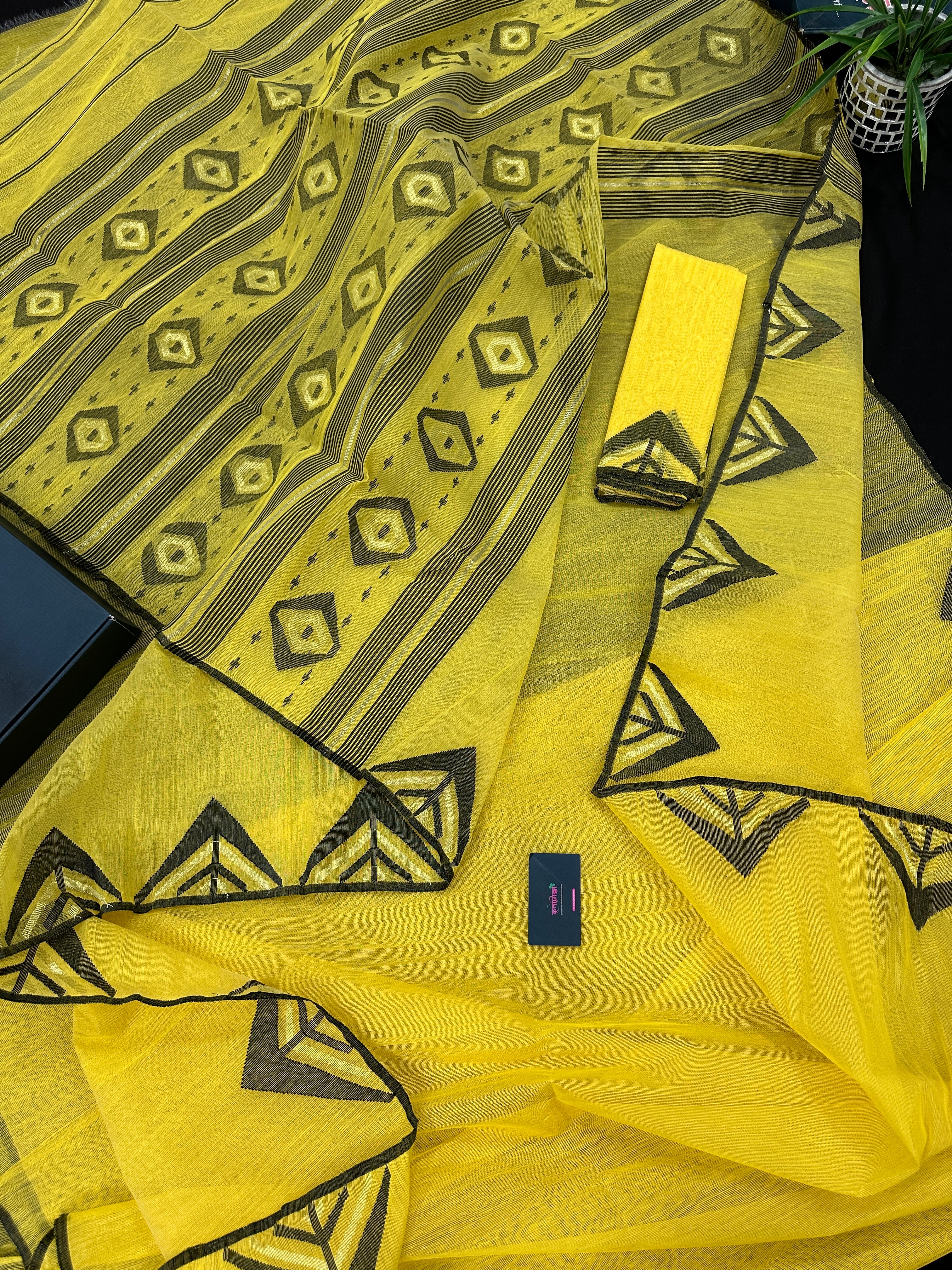Yellow cotton jamdani sari with simple paar.