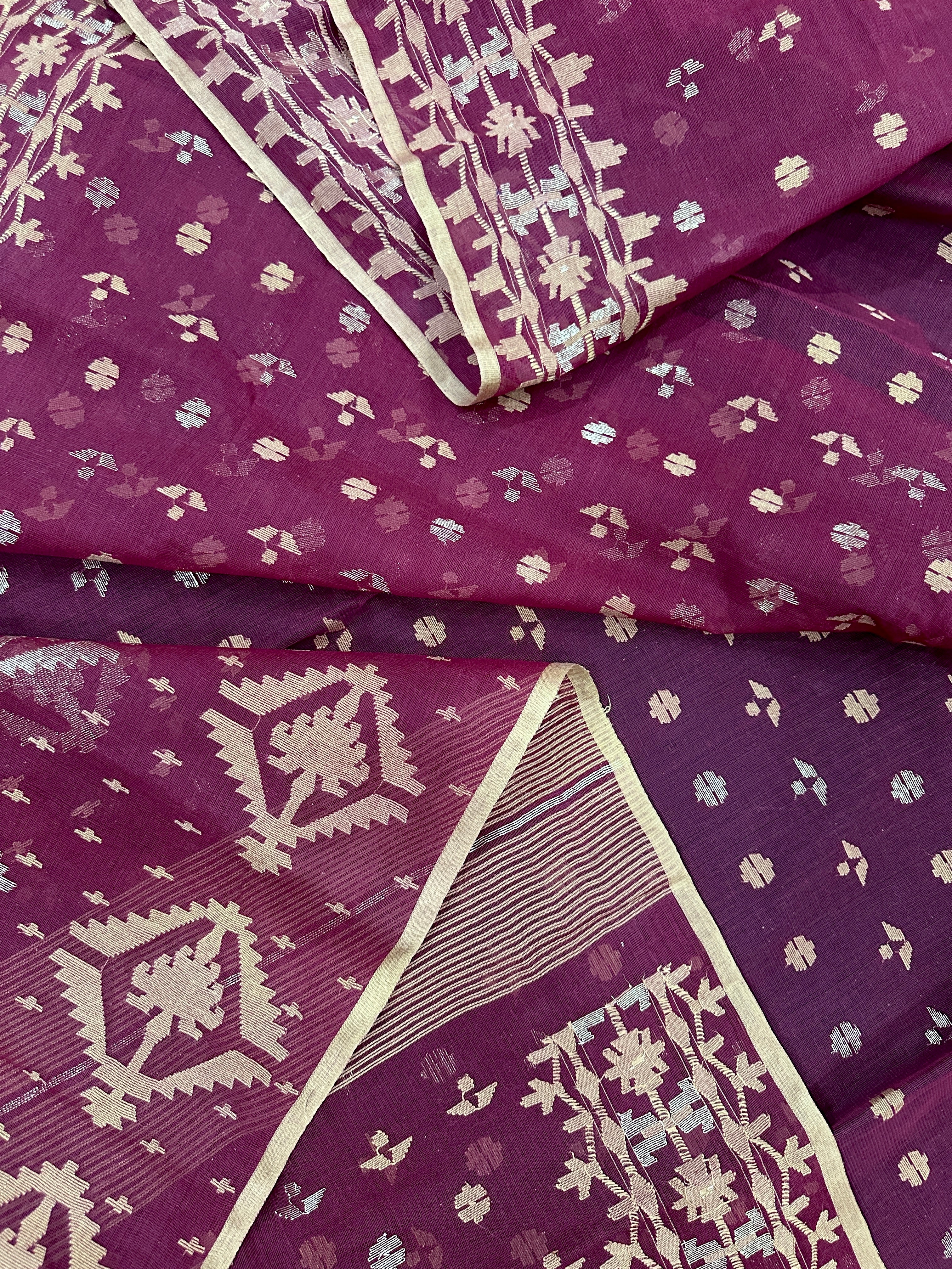 Maroon cotton jamdani with yellowish threads work.