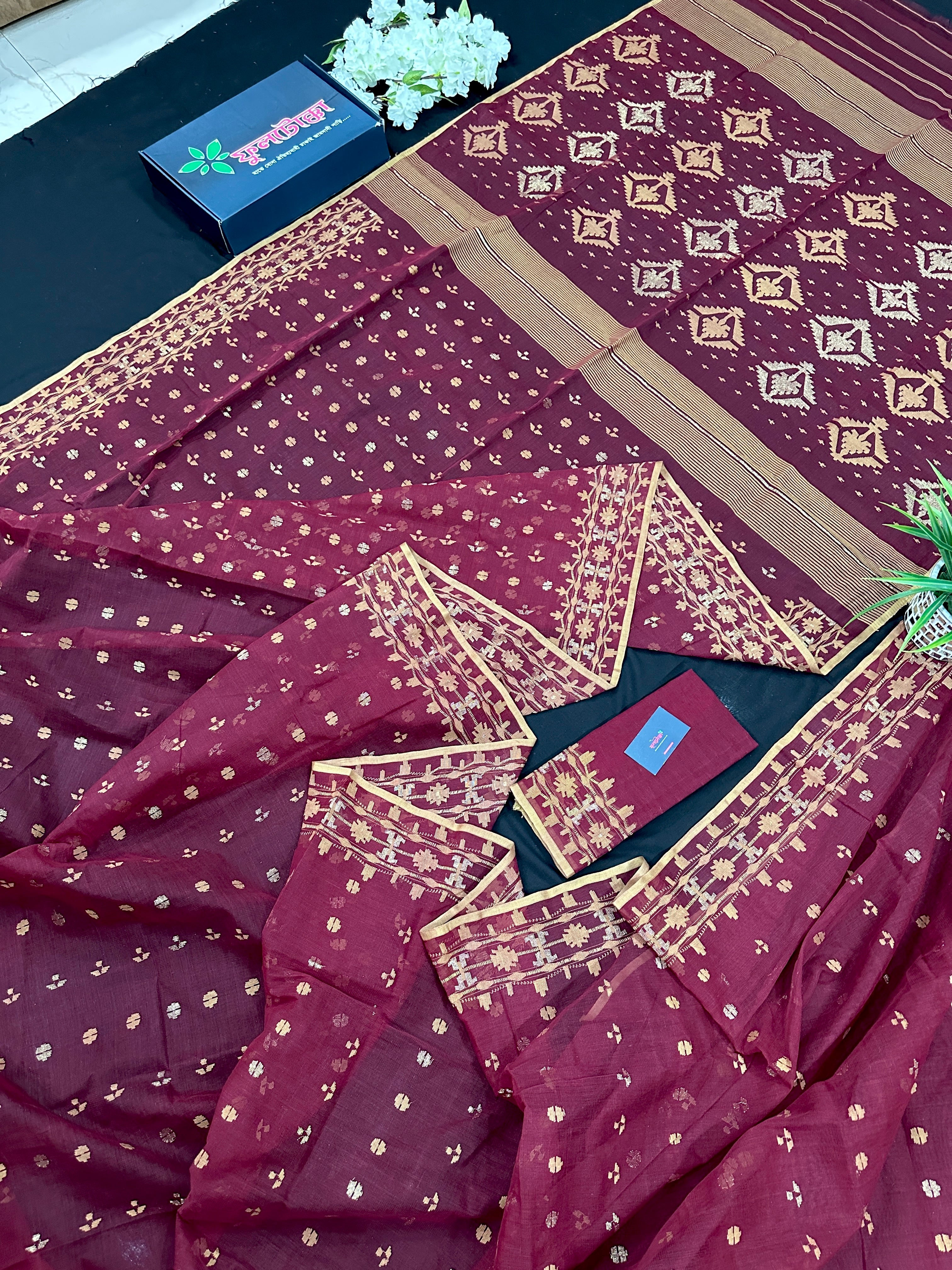 Maroon cotton jamdani with yellowish threads work.