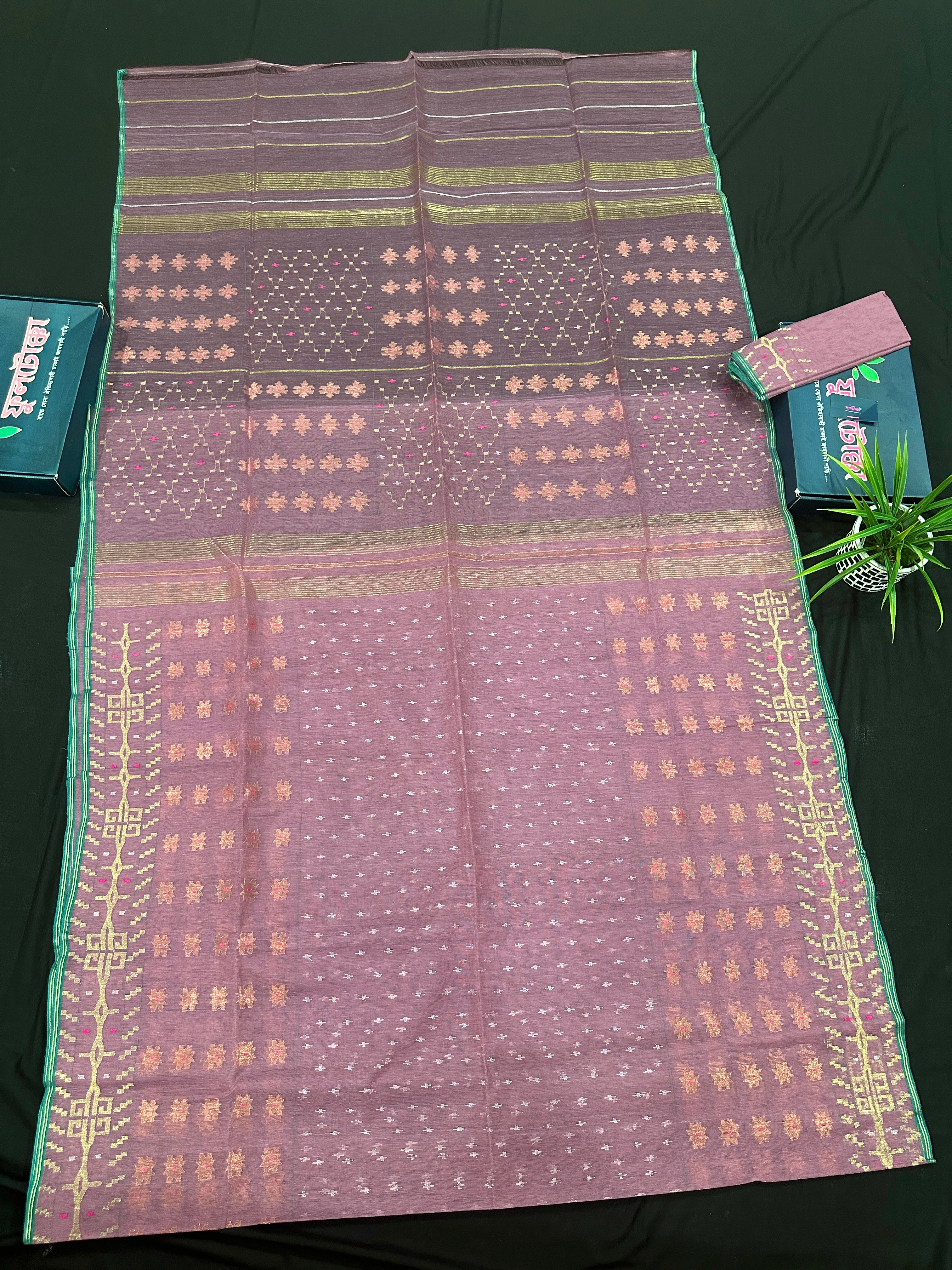 Onion colour jamdani saree with pink meena and green border.