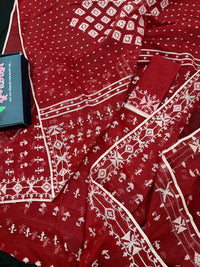 Maroon jamdani saree with white thread work.