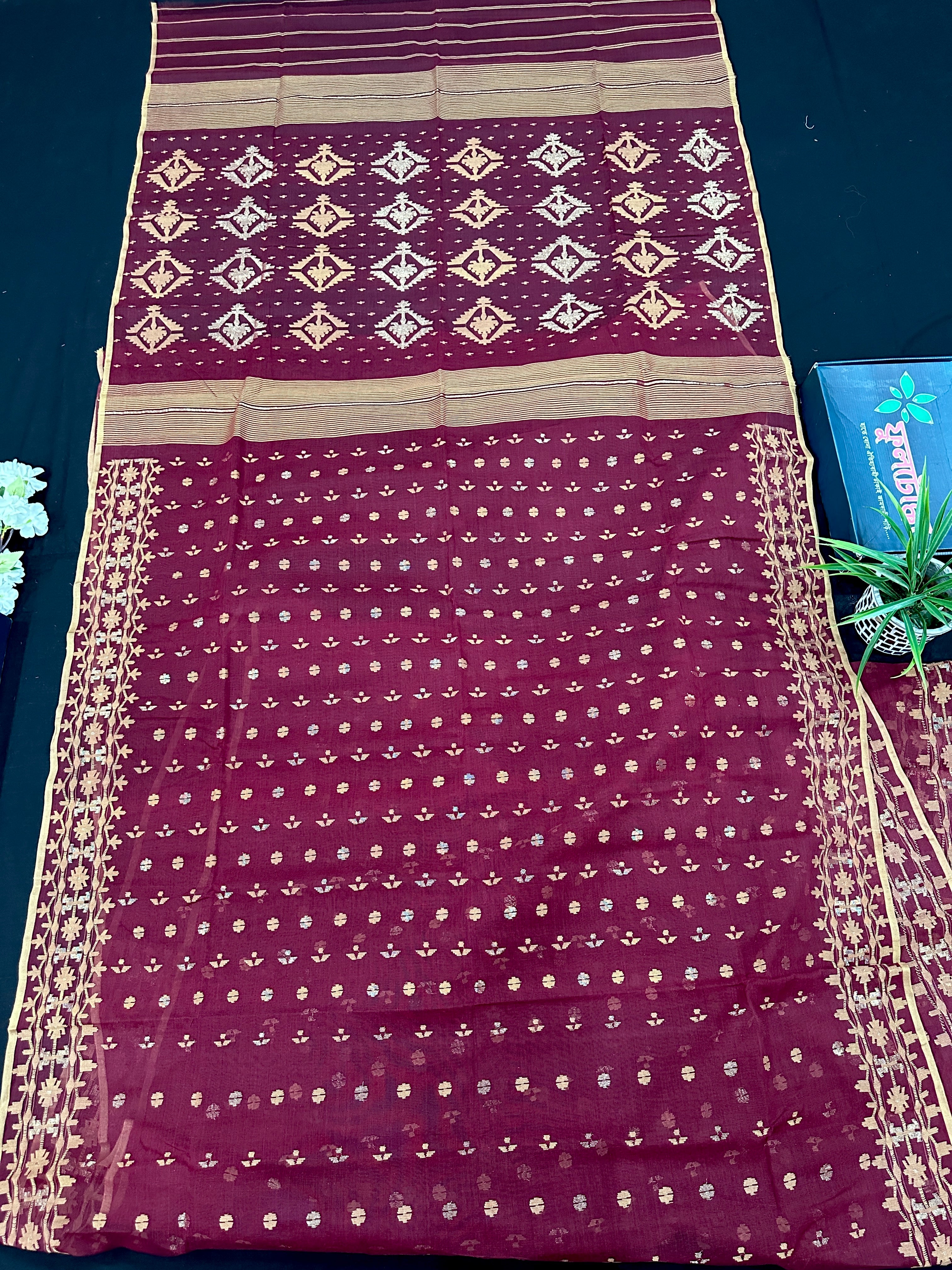 Maroon cotton jamdani with yellowish threads work.