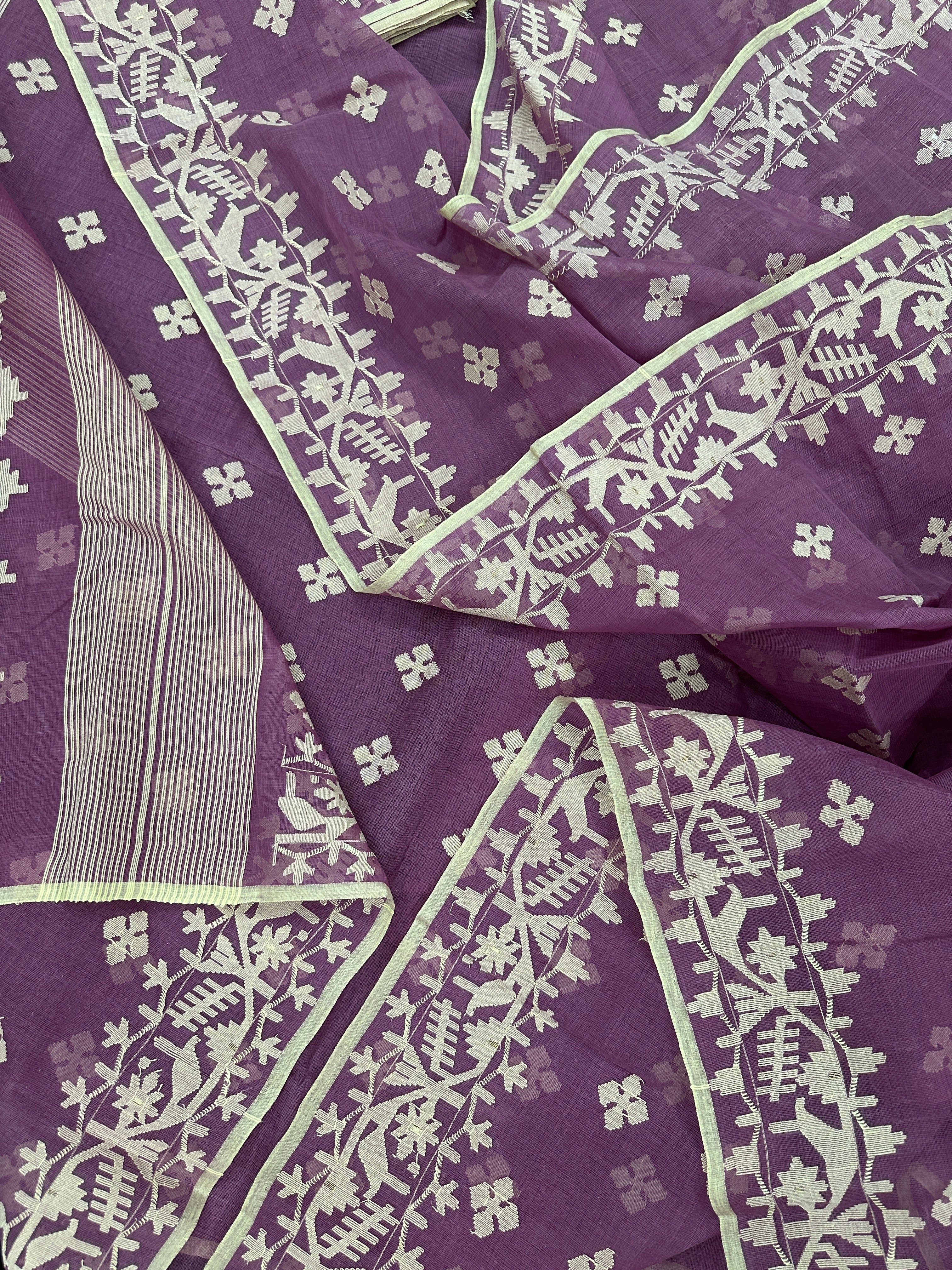 Onion cotton jamdani saree with yellowish threads work all over work.