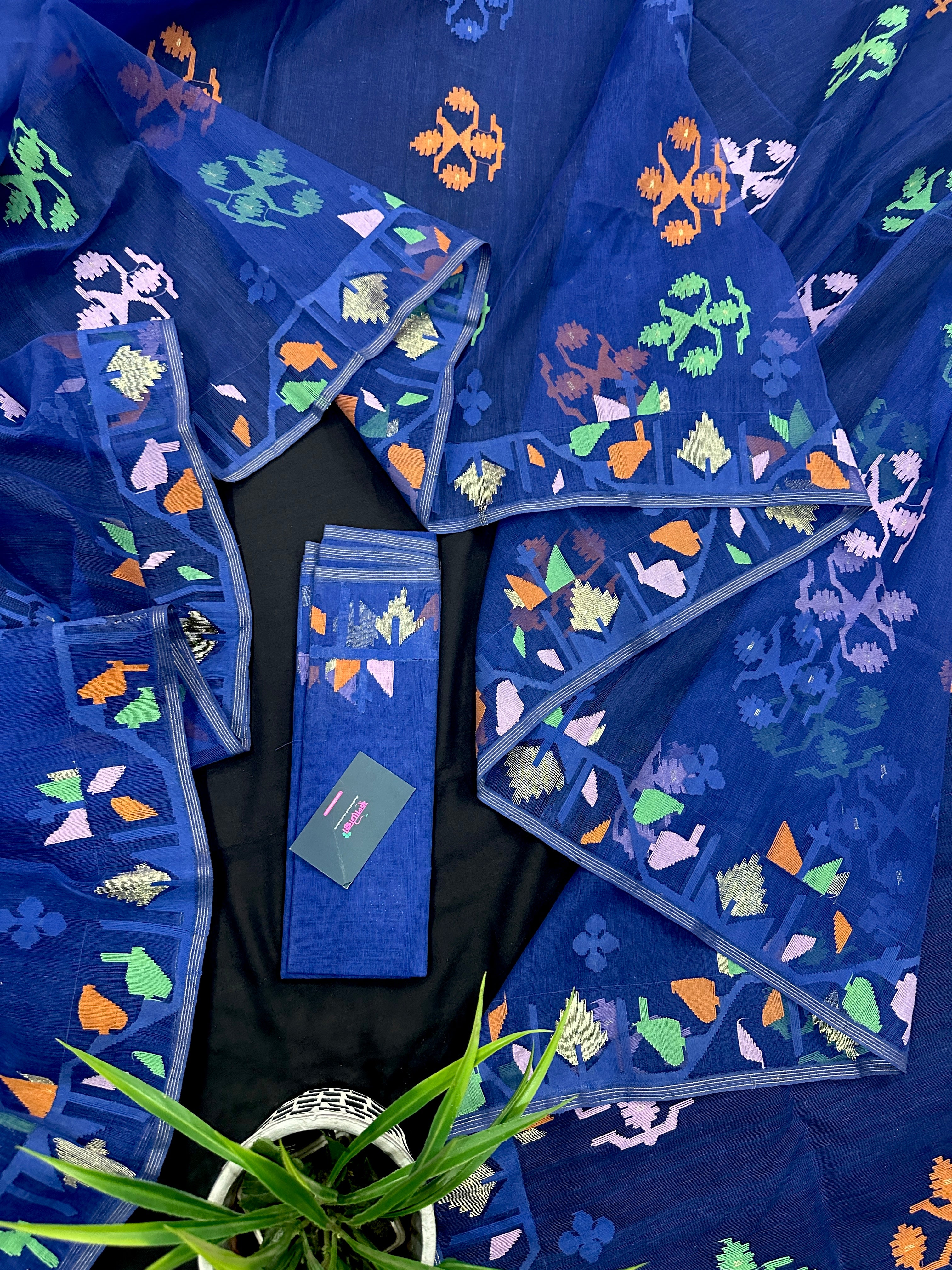 Royal blue jamdani saree with green pink blue orange threads work.
