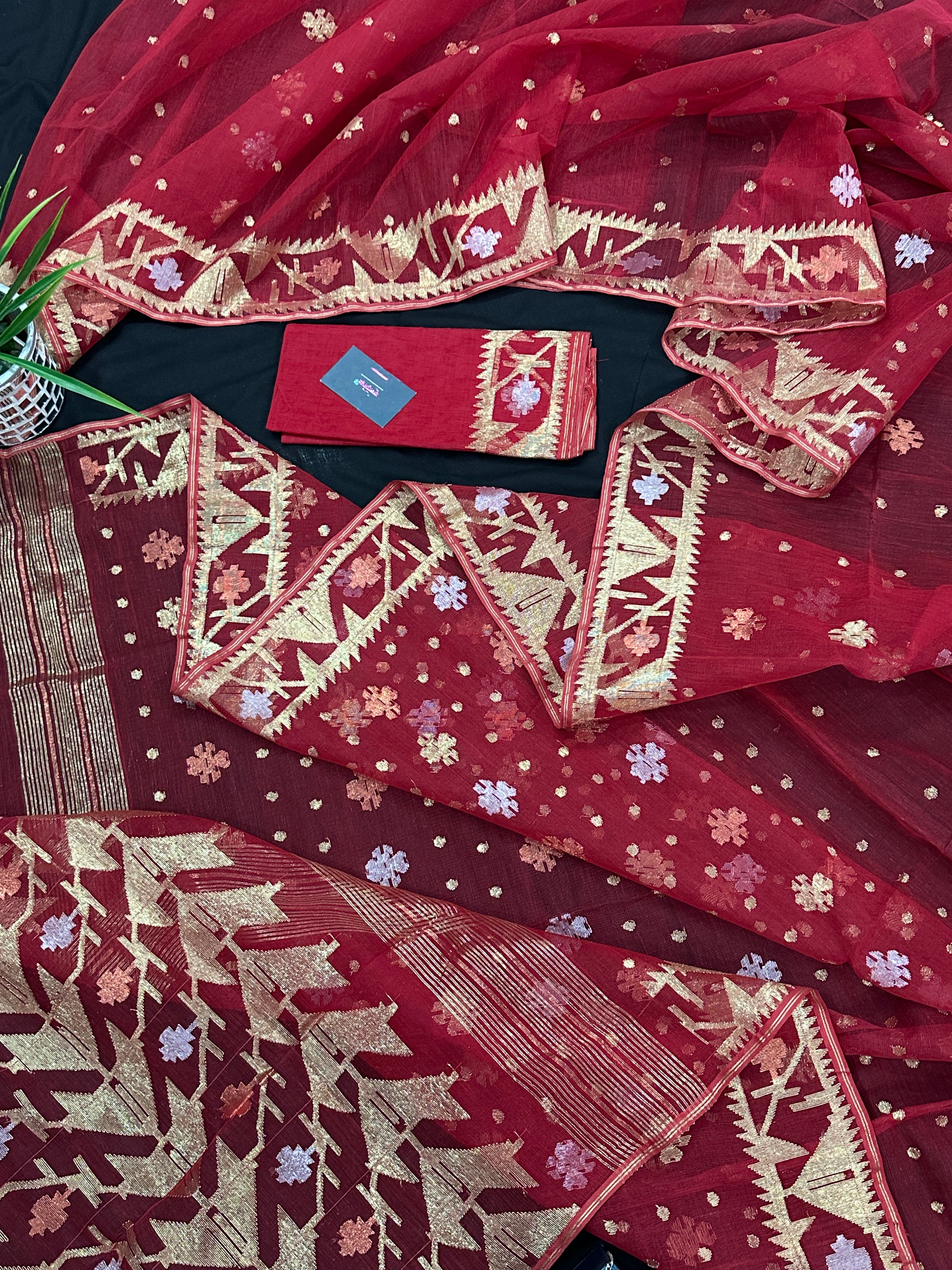 Red jamdani saree with golden jori all over work with blouse piece.