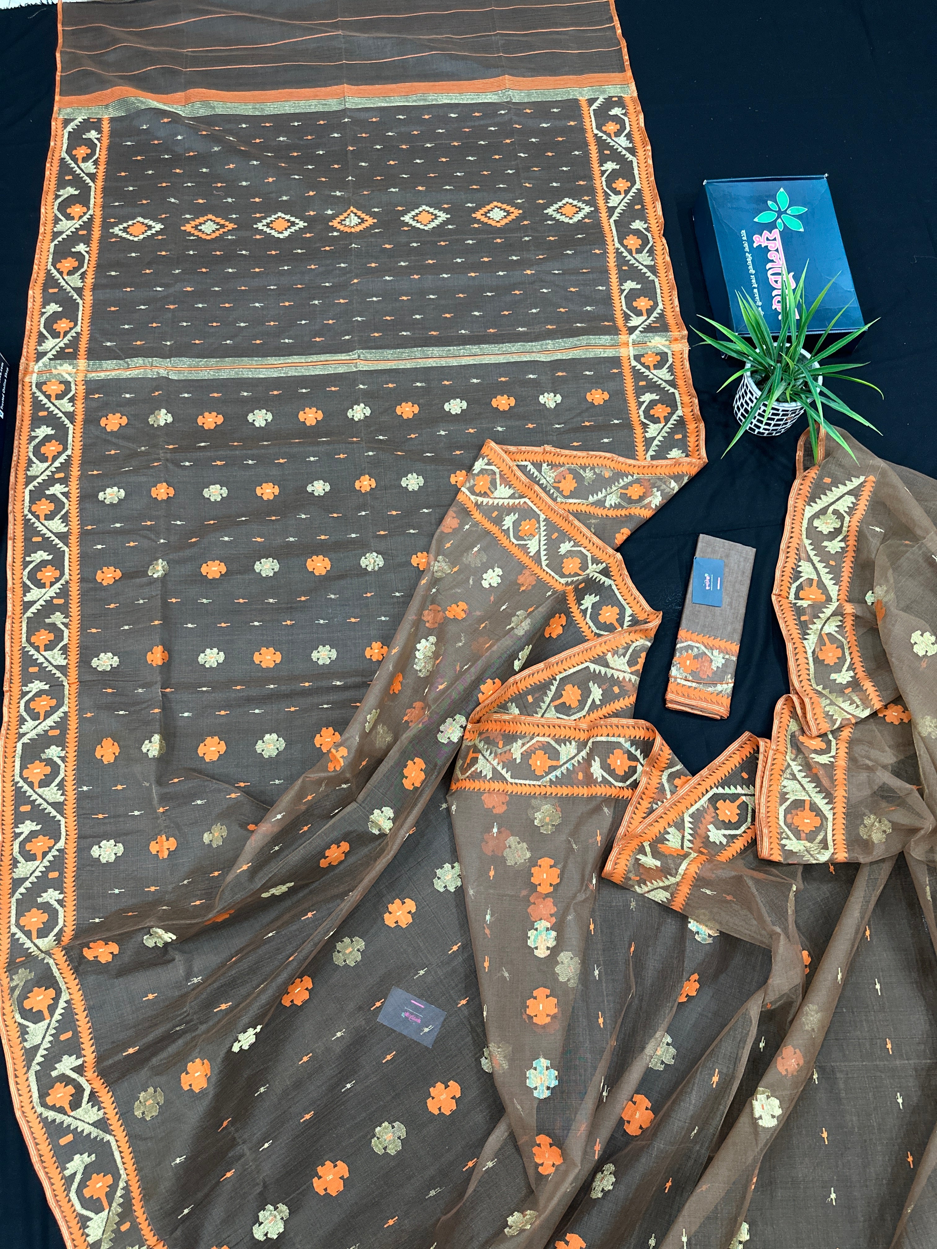 Peanut Brown dhakai jamdani saree with orange threads work & golden jori work all over soft count.