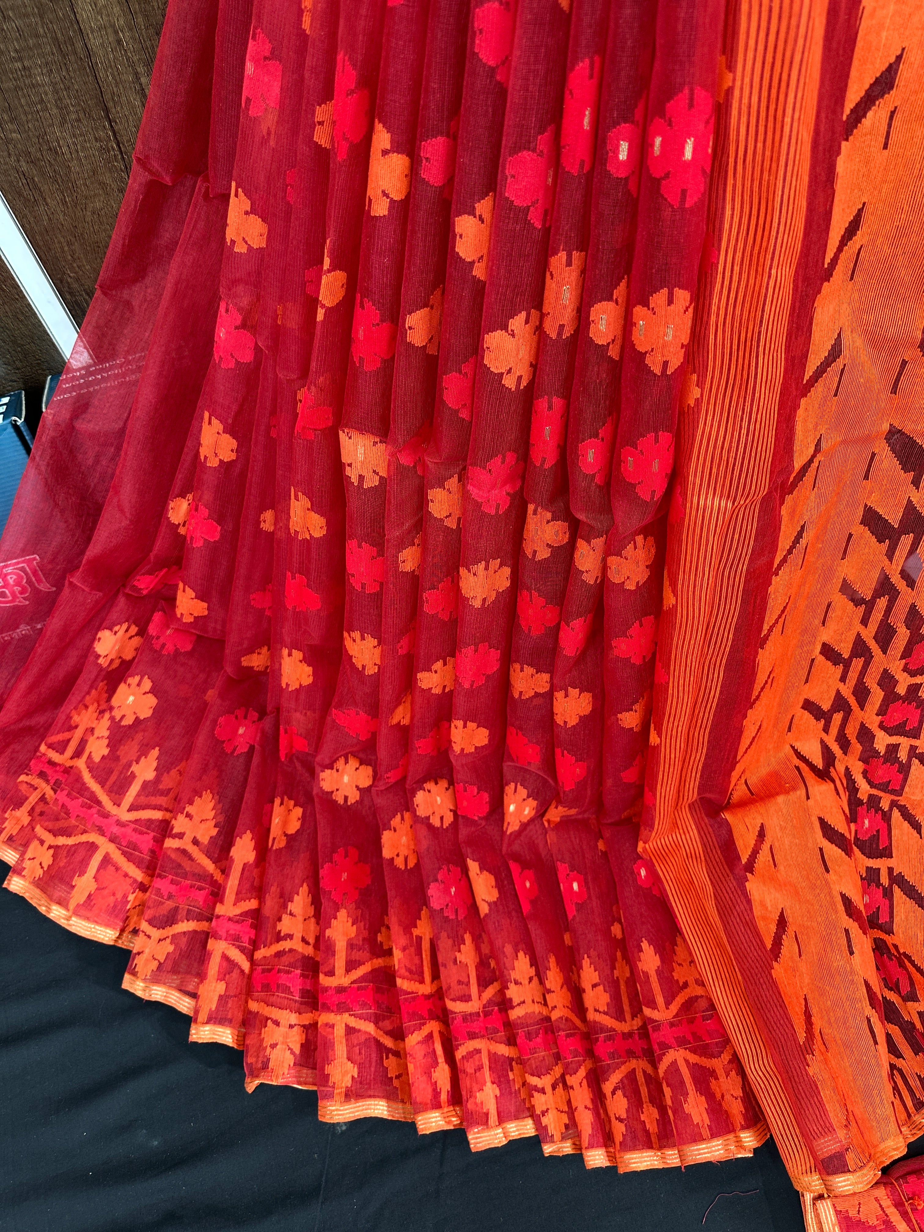 Maroon red jamdani saree with orange and red threads work
