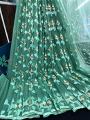 Jade green halfsilk jamdani saree with green off white golden self threads work