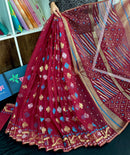 Maroon jamdani saree with golden jori work all over work with blouse piece.