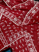 Maroon jamdani saree with white thread work.