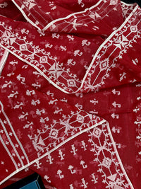 Maroon jamdani saree with white thread work.